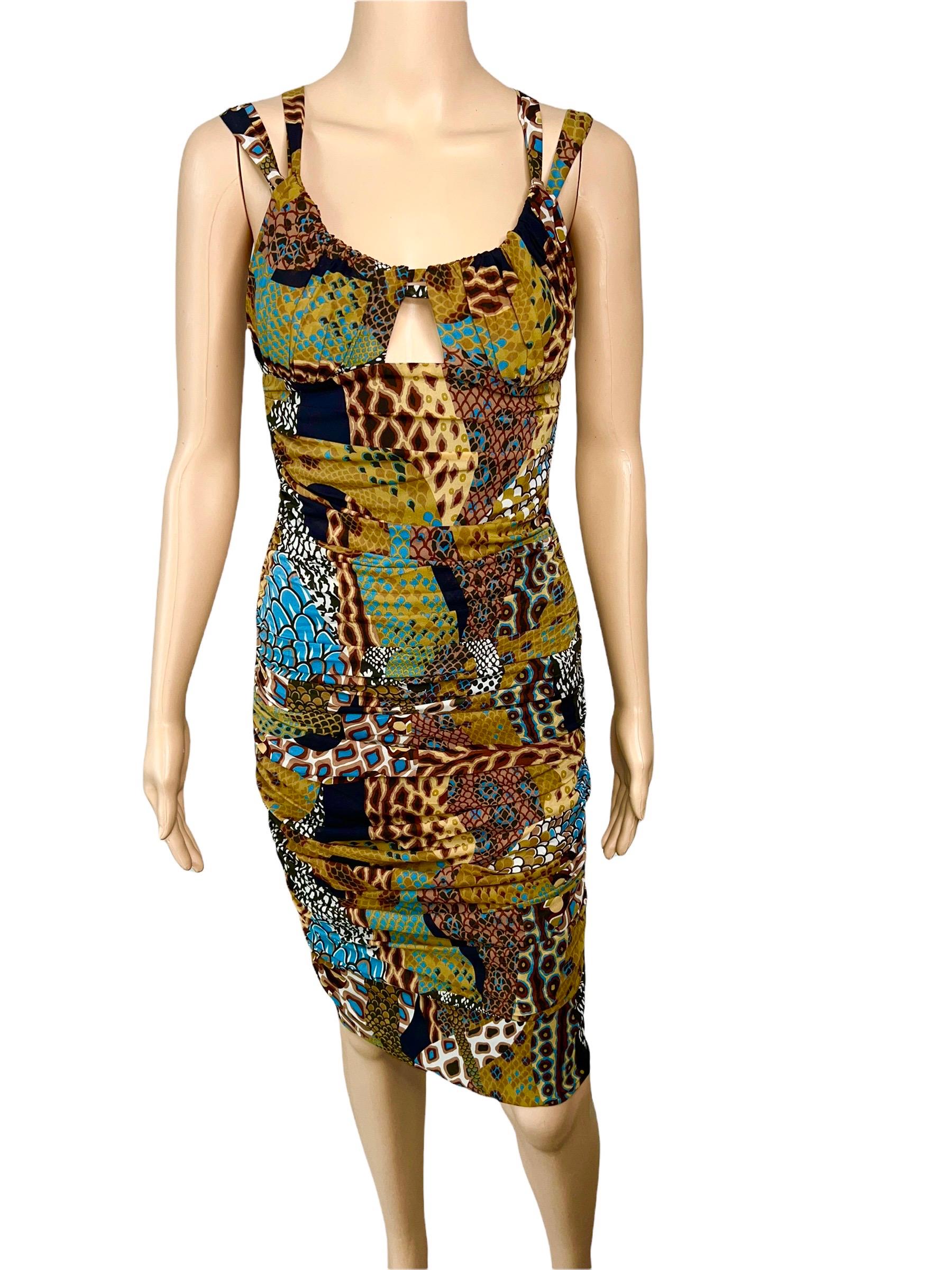 Versace F/W 2005 Runway Plunging Neckline Ruched Animal Print Dress IT 44 

Look 23 from the Fall 2005 Collection. Brown and multicolor Versace silk mini dress with abstract print throughout, keyhole opening at bust, and concealed zip closure at