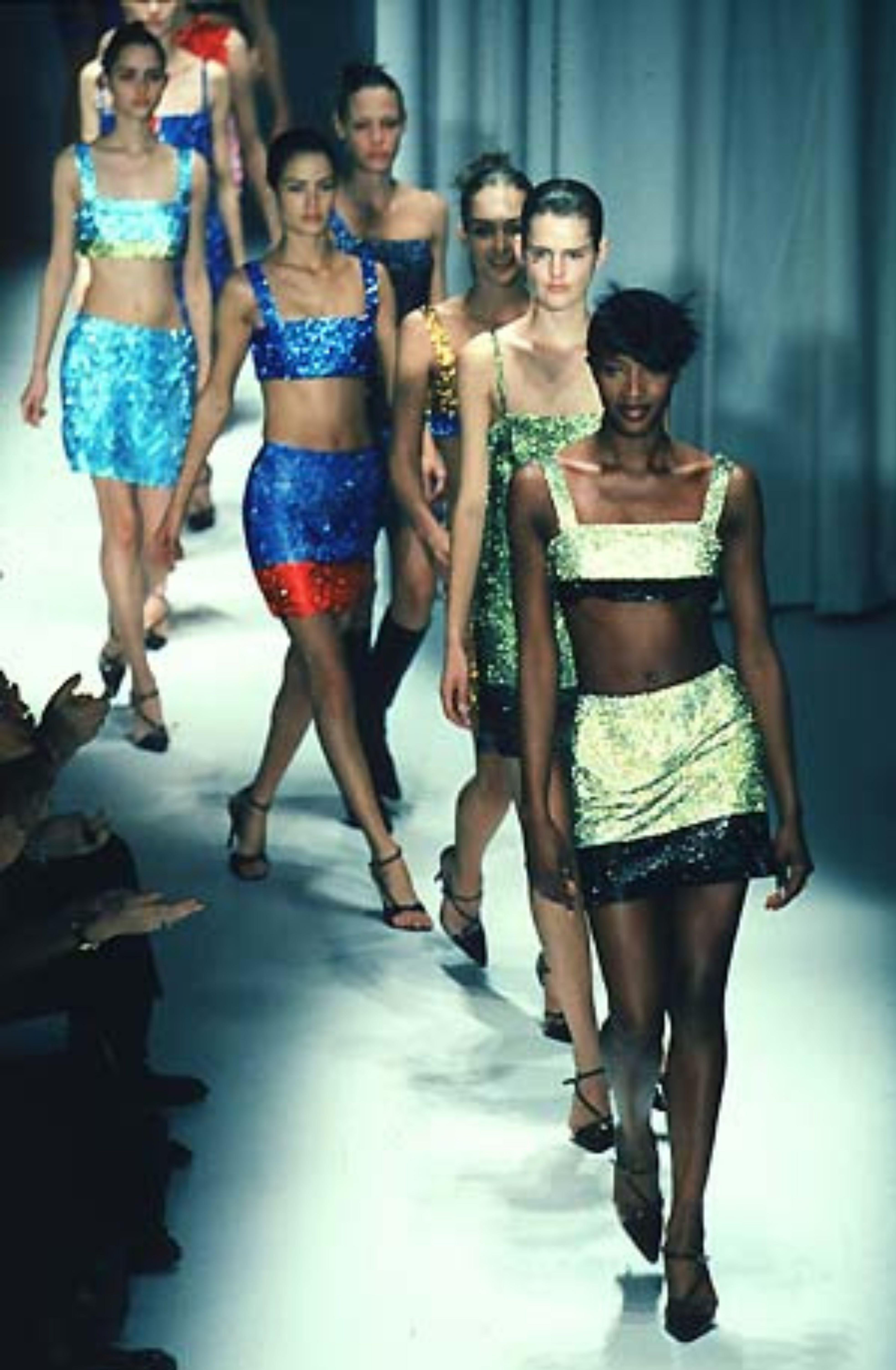 Vintage Gianni Versace
Fall 1997 - similar pieces seen on the runway

Black & gold metal Oroton chainmail skirt
Mini length 
Fully lined with satin 
Zip up side
No size tag, see measurements
Measurements - 
Waist 25”
Hips 36.5” 
Length