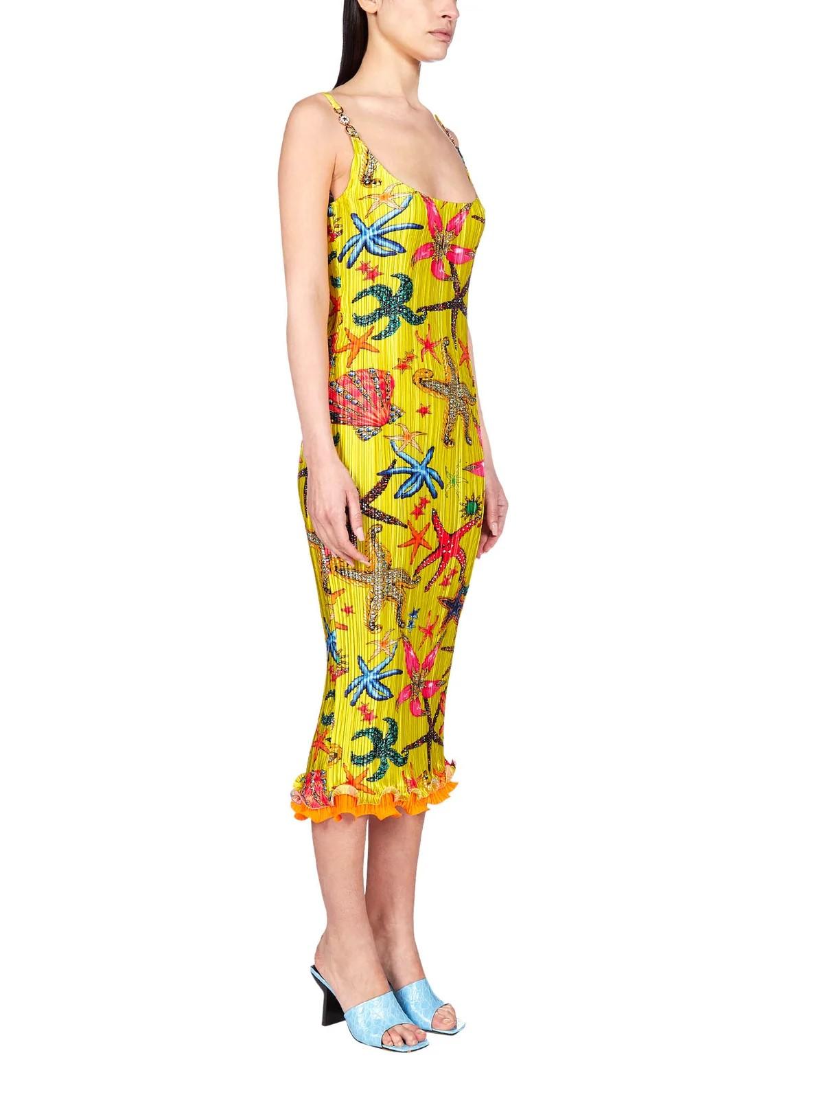 Sleeveless garment-pleated satin mid-length dress in yellow featuring graphic pattern printed in multicolor. Hardware at spaghetti shoulder straps. Scoop neck collar. Lettuce edge in orange at layered hem. Unlined. Rose gold-tone hardware. Supplier