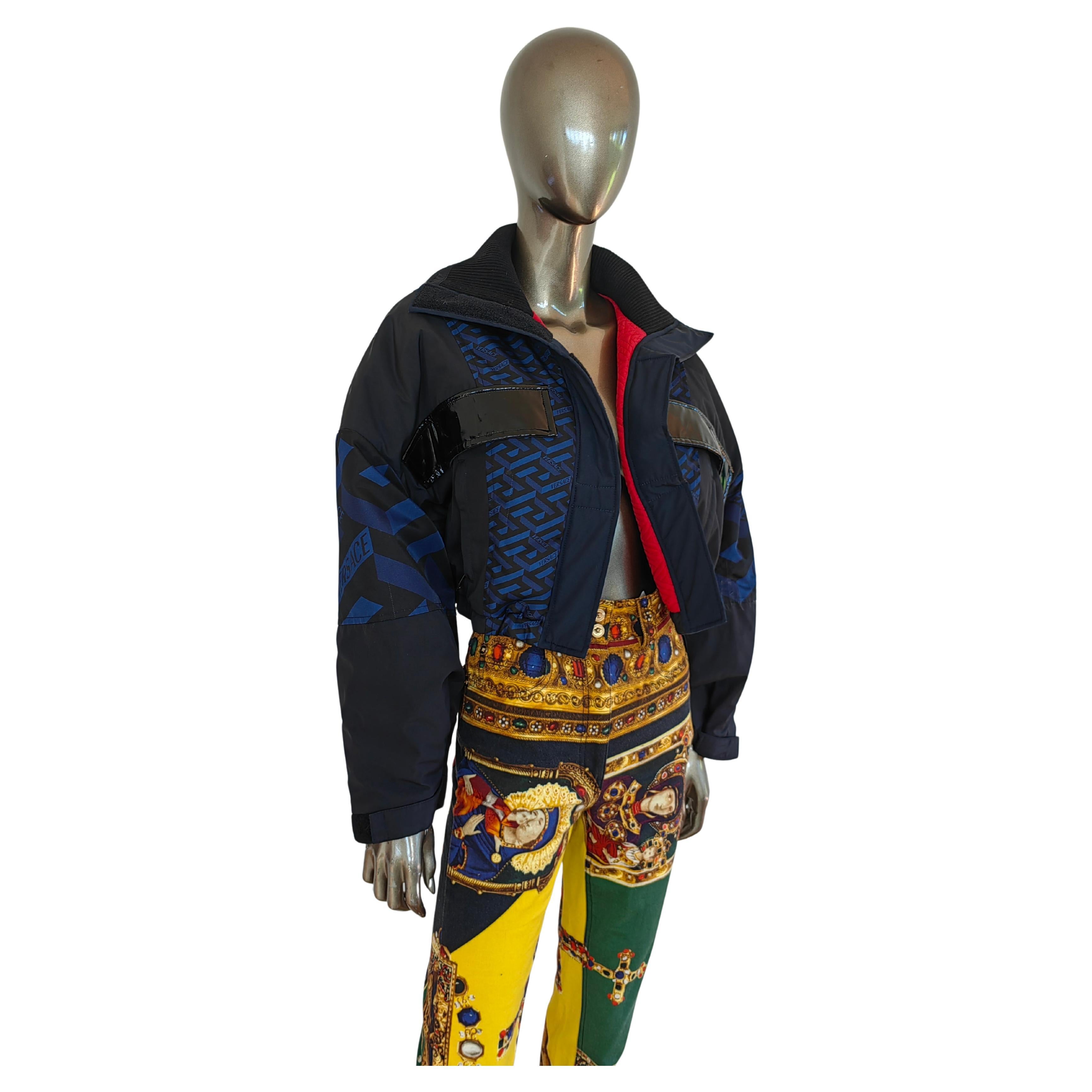 Elevate your outerwear collection with this Versace Fall/Winter 2021 Blue Greca Parka Short Jacket, a bold and stylish piece from the luxury Italian fashion house. Featuring Versace’s signature Greca motif patchworked in Navy Blue,  and a huge