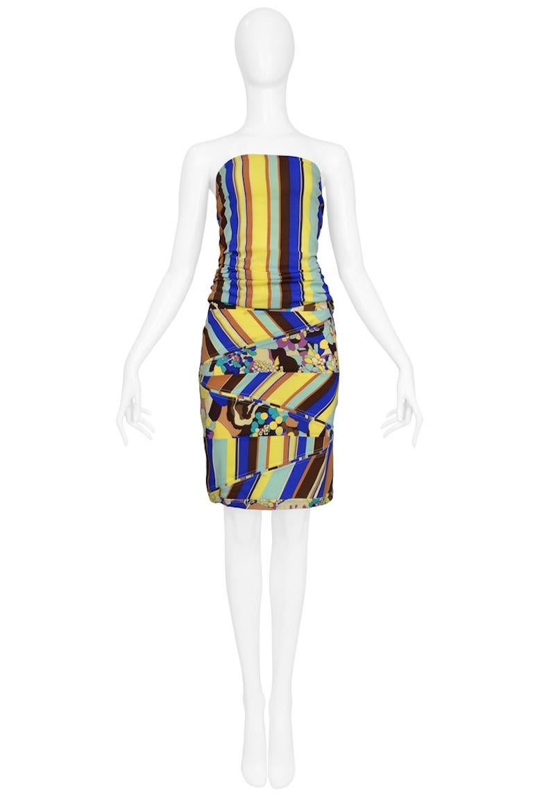 Resurrection Vintage is pleased to offer a vintage Versace yellow, blue, and brown striped top and skirt ensemble featuring floral insets, strapless top with side zipper, and a fitted pencil style skirt with zipper. Circa 2000s. 

Versace 
Size