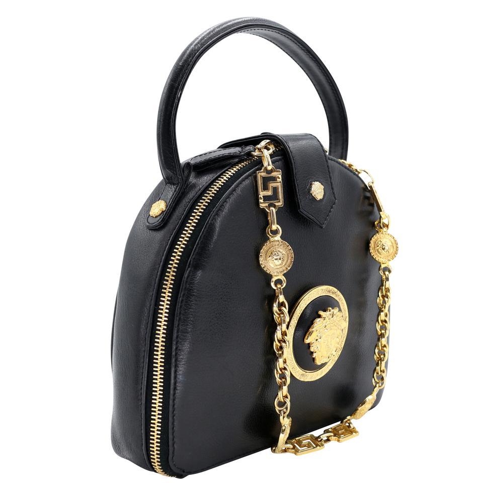 This is a classic Gianni Versace Medusa gold chain link pattern shoulder bag features two handle straps. Made with elegant leather and medusa art patterned canvas with black leather straps and trim, still in excellent condition. The leather includes