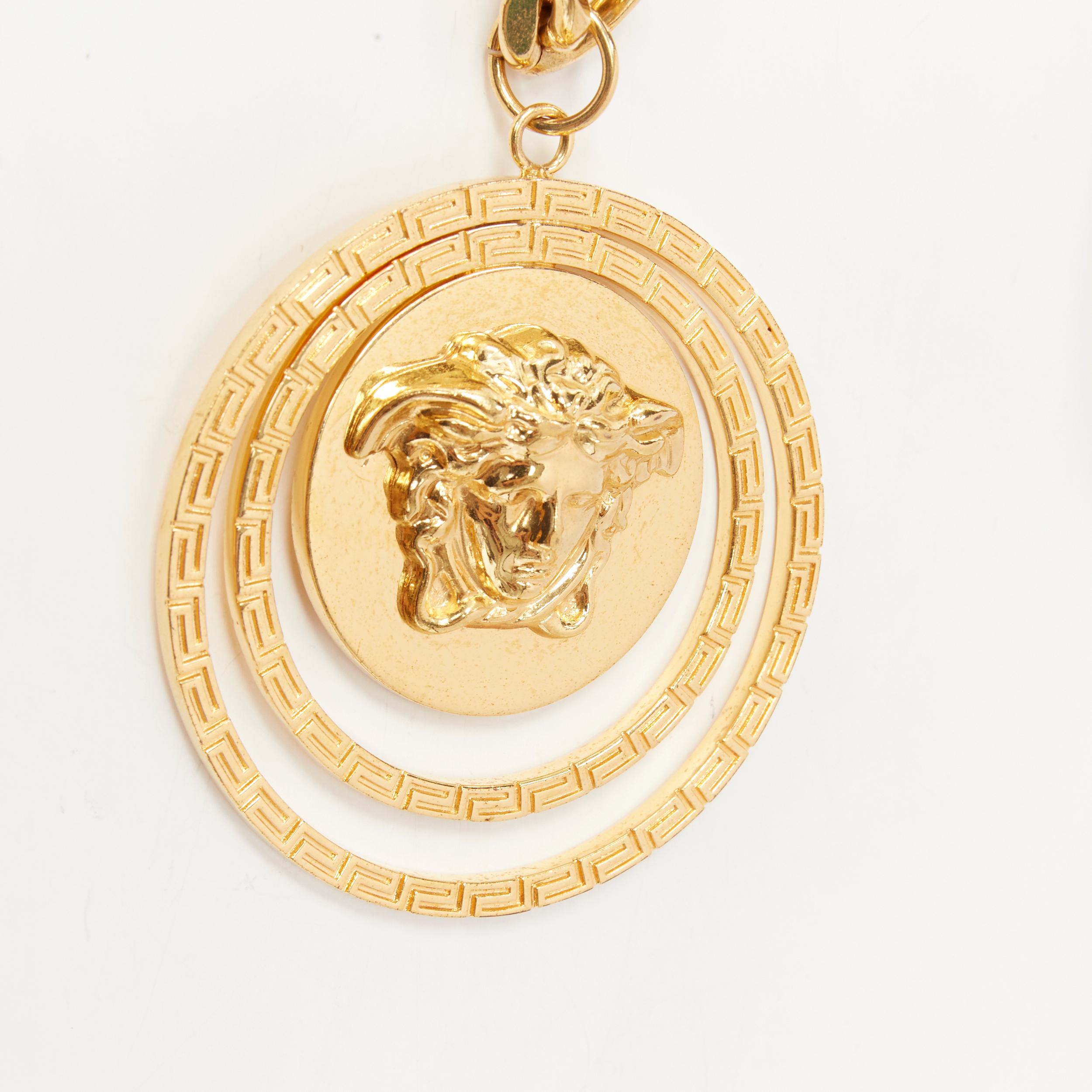 VERSACE gold brass triple Greca halo Medusa coin pendant chunky chain necklace 
Reference: TGAS/B01646 
Brand: Versace 
Designer: Donatella Versace 
Material: Nickel 
Color: Gold 
Pattern: Solid 
Extra Detail: 3D Medusa face on chain. Double Greca