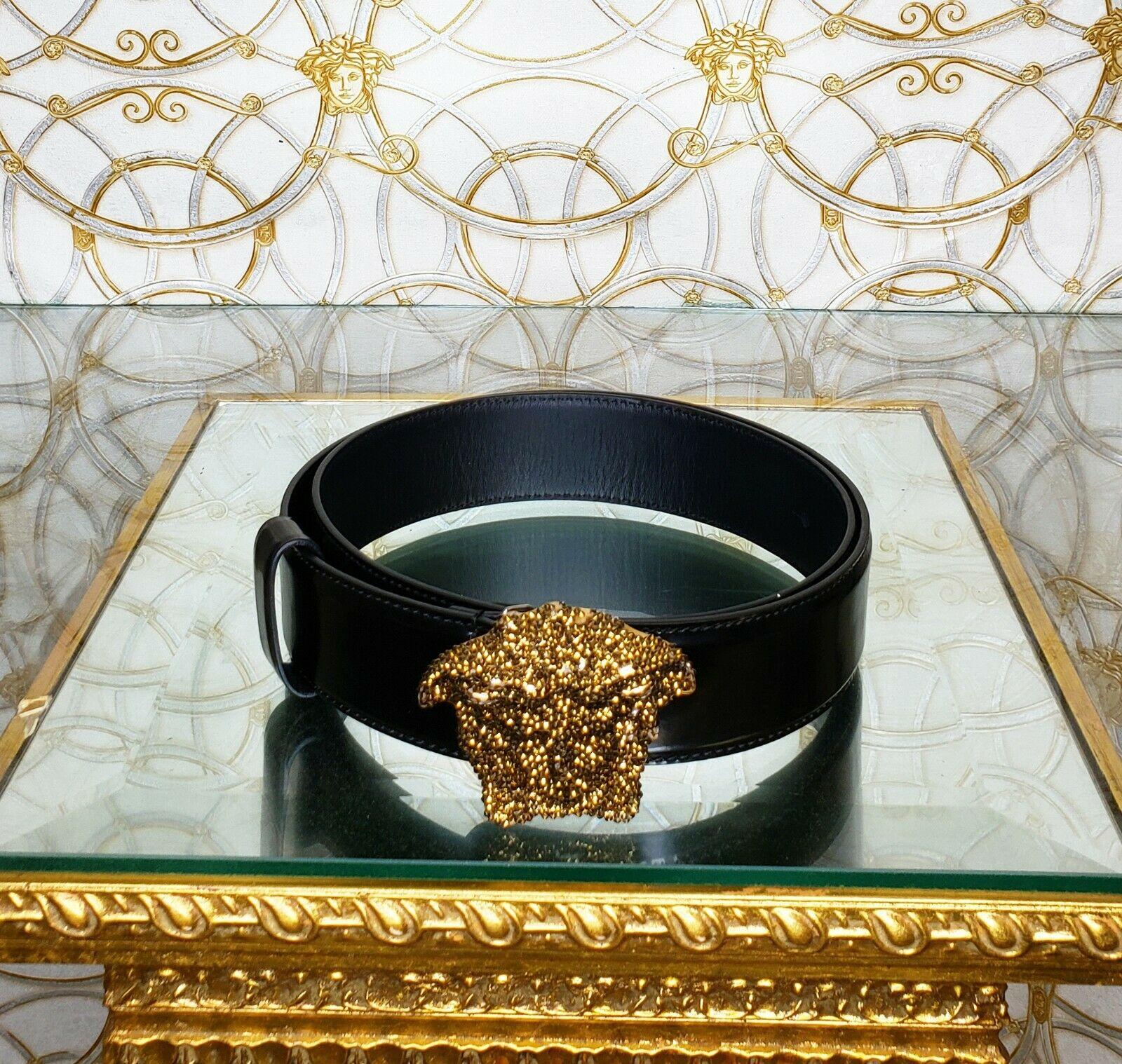 VERSACE

 VERSACE GOLD CRYSTAL EMBELLISHED 3D MEDUSA BLACK PATENT LEATHER BELT 
SOLD OUT EVERYWHERE!

Made in Italy
 Size 75/30

     1 1/2