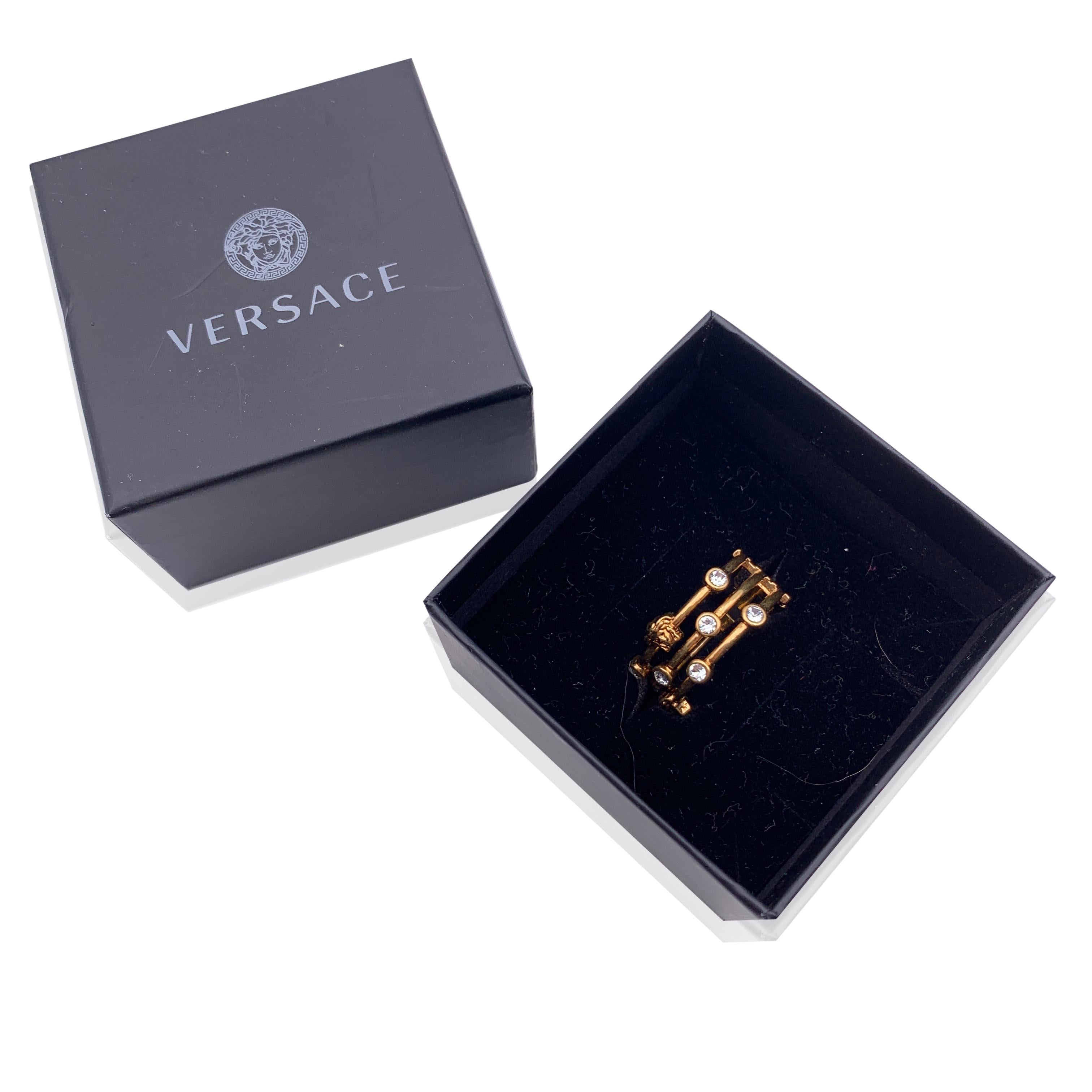 Beautiful Versace Medusa band ring. Crafted of gold metal, it features small white crystals and small medusa head. Size: 25 (US size 10.5). 'Versace - Made in Italy' engraved internally.


Condition

A+ - MINT

Never worn or used. Please, look