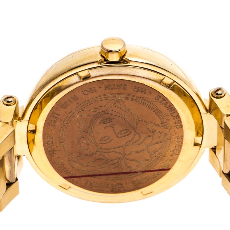 This Mystique women's wristwatch by Versace has a gold-plated stainless steel bracelet and case that lends durability without compromising on glamour. The round bezel surrounds a lovely dial with gold-tone hands. The dial is further beautified with