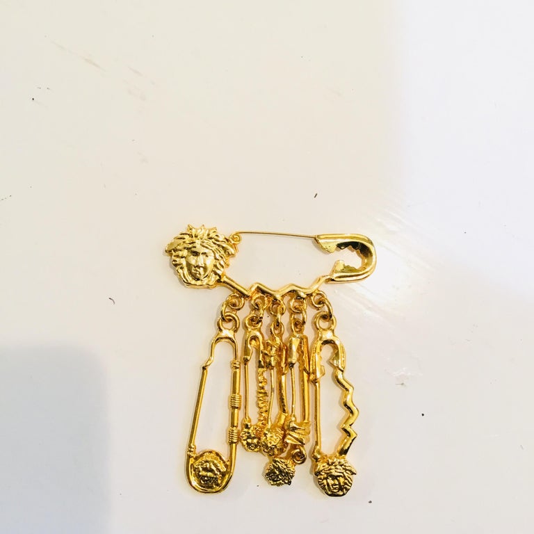 Versace Gold Safety Pin Medusa Dangle Brooch at 1stDibs | versace safety pin  brooch, versace pin brooch, versace brooch