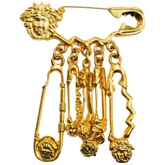 Versace Gold Safety Pin Medusa Dangle Brooch