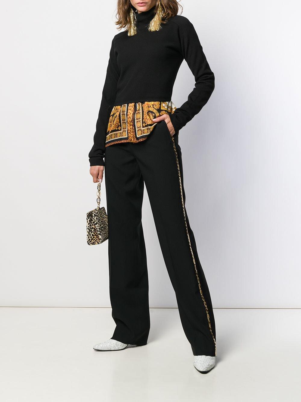 Versace Gold Tone Greca Chain Tailored Black Trousers / Pants

Black Greca-chain tailored trousers from Versace featuring tailored cut, greca chain-link detailing, concealed front fastening, two side slit pockets, two rear welt pockets and straight
