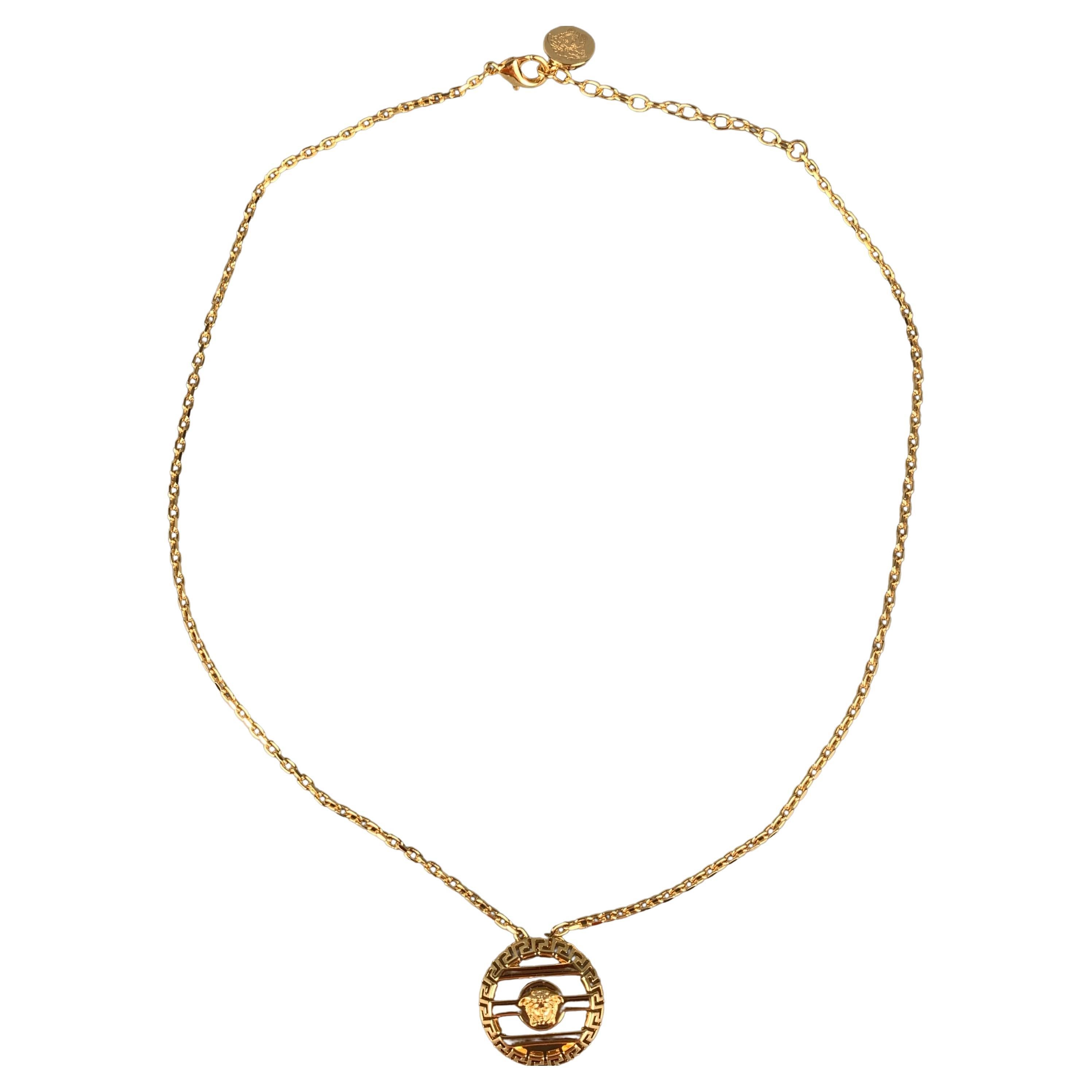 Gold round hotsell cage medusa necklace