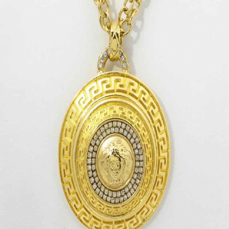 Versace Medusa necklace features gold-tone hardware, round medallion pendant with Medusa logo at front surrounded by lab-created crystals and lobster claw closure.


67407MSC