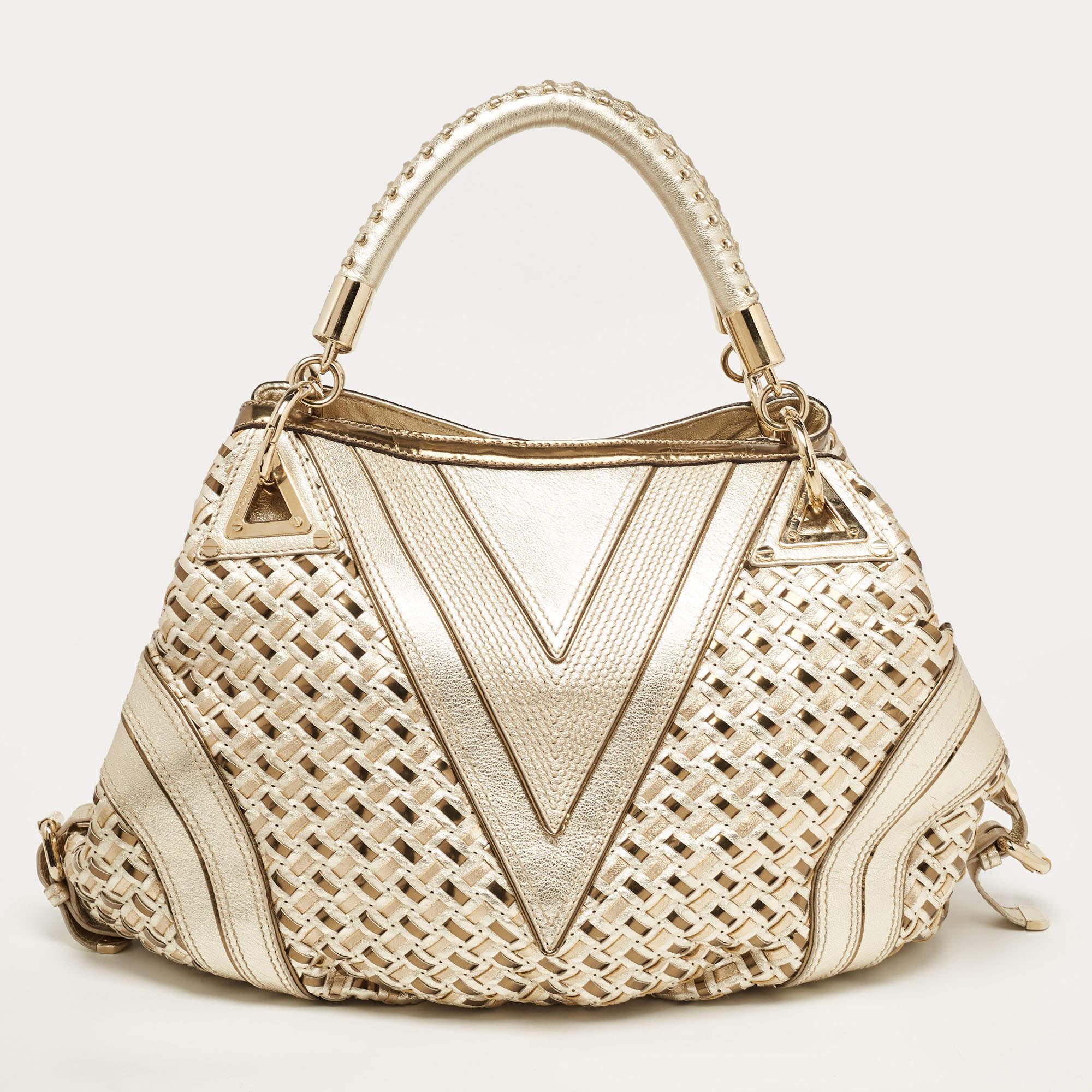 This satchel is built to hold your essentials in the most fashionable way! Easy to style, well-made using the best materials, and coming from a coveted brand, the Versace satchel will add immense style to your ensemble.


