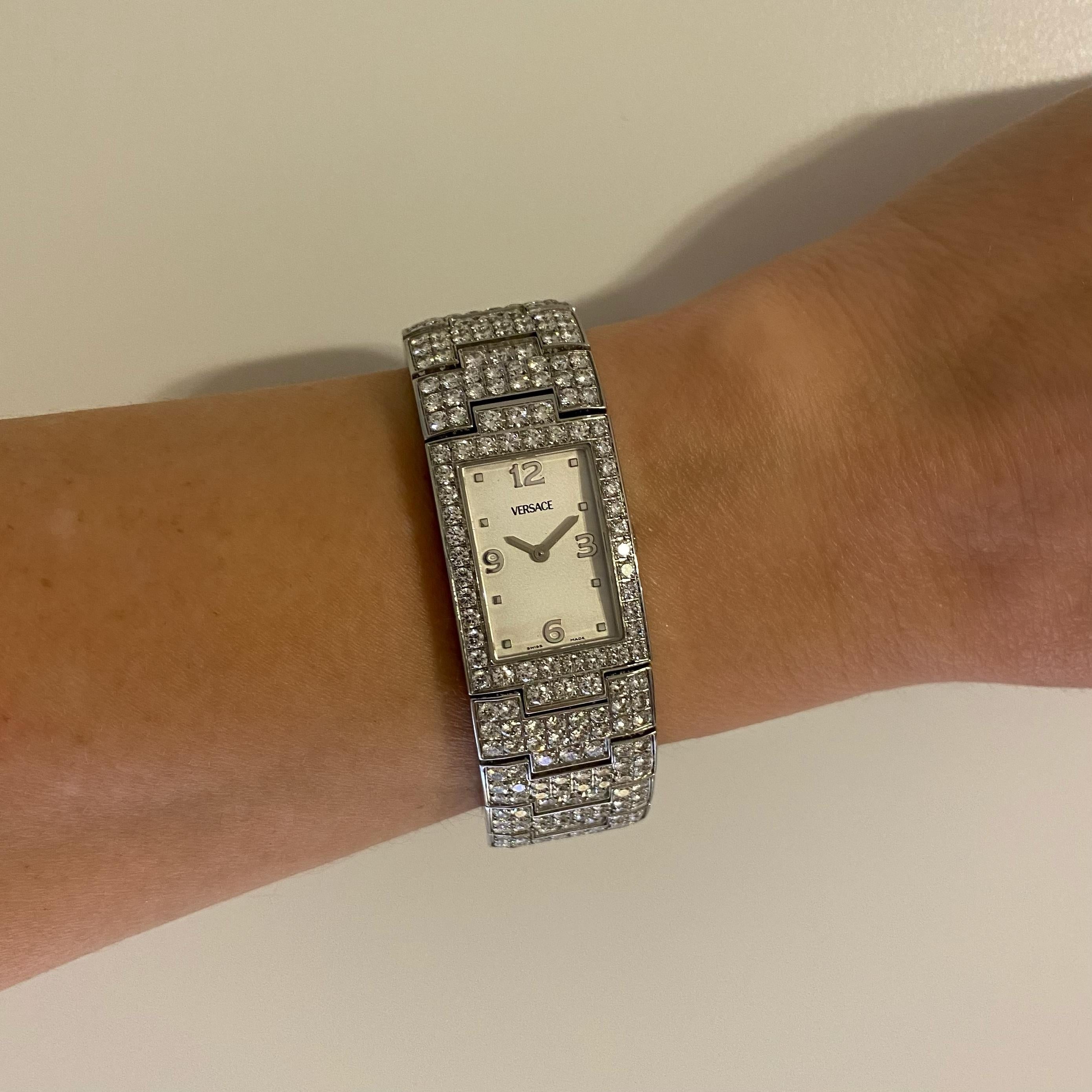 Simply Beautiful! Rare Versace Greca 990139 Stainless Steel Diamond Wrist Watch. Watch and Bracelet Hand set with 446 round Brilliant cut Diamonds, weighing approx. 15.75tcw. Swiss Made, Quartz Movement. 30mm tall x 20mm wide. More Beautiful in real