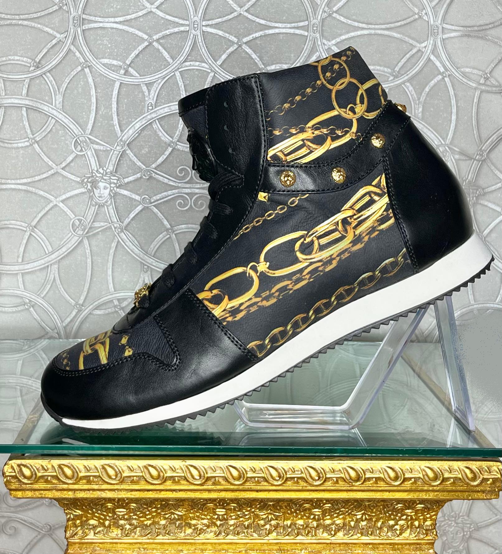 VERSACE 

VERSACE HIGH-TOP SNEAKERS with MEDUSA BUCKLE and GOLD-TONE METAL ELEMENTS 
  
This shoe is embodied in true Versace-style and  features a great mix of black smooth leathers with gold-tone accents.  
3 D Medusa complement the black leather