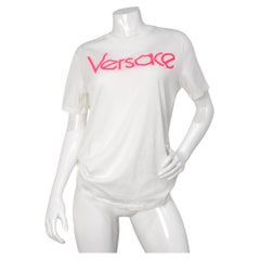 Maglietta Versace in cotone bianco con ricamo rosa caldo