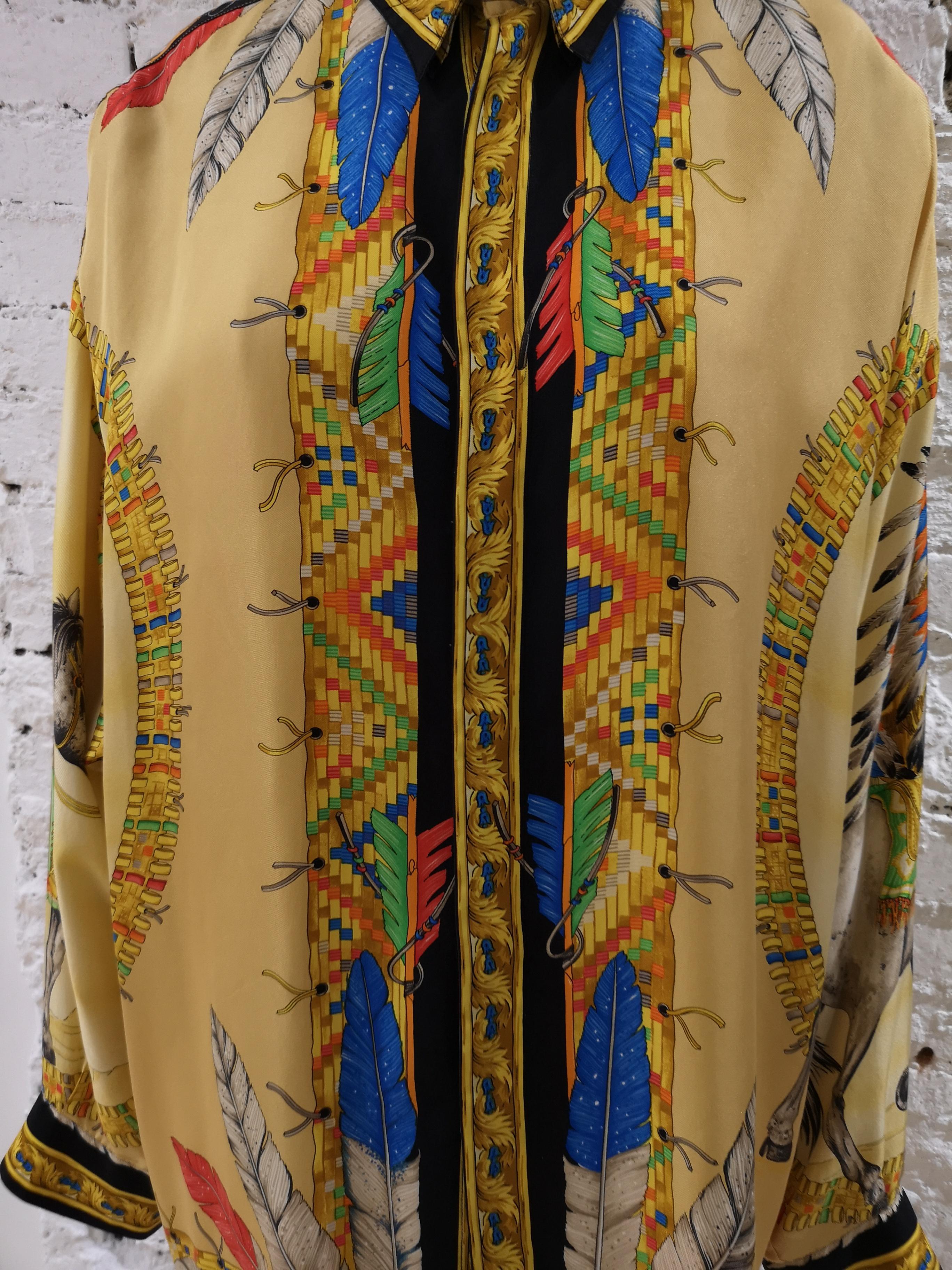 Versace Indian Silk Shirt 
Multicoloured silk print shirt from Gianni Versace featuring a pointed collar, a concealed front fastening, long sleeves and button cuffs. 

Made in Italy in size 48 IT
Composition: Silk 100 %