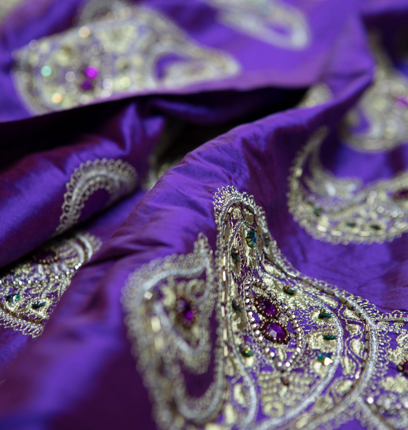 Vintage, theatrically created for celebrities in a violet iridescent raw silk fabric with highly embellished dramatic paisley design of hand-hooked metallic embroidered gold and silver in a Classic Ari handwork with amber, amethyst and emerald
