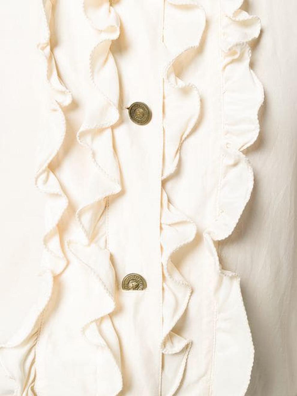 Versace ivory silk shirt featuring  front silk frills, front logo Medusa buttons, a shirt collar.
In excellent condition. Made in Italy. 
Estimated size 40fr/US8/UK12
We guarantee you will receive this gorgeous item as described and showed on