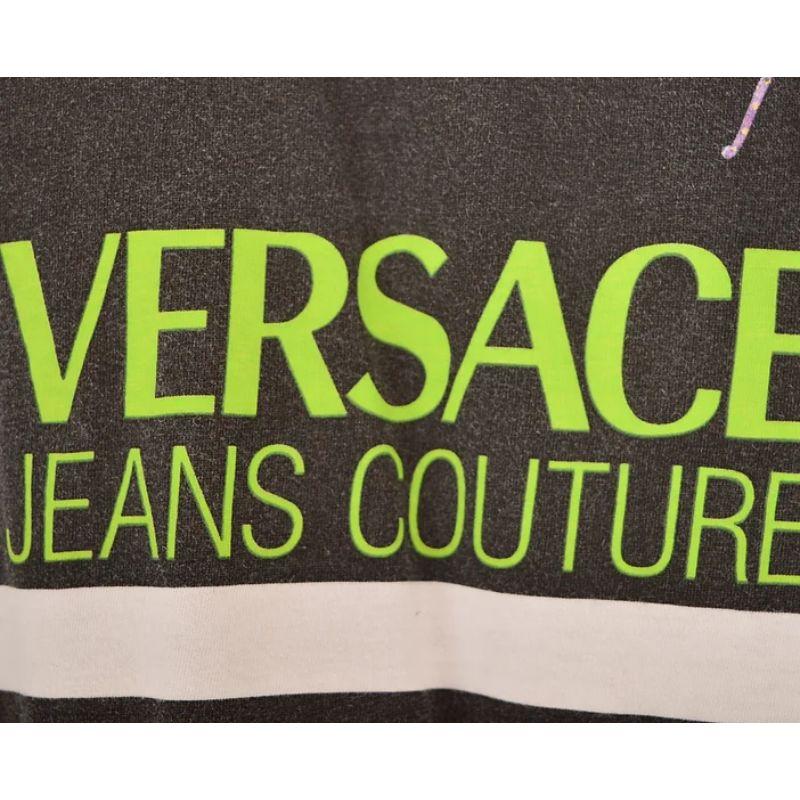 Rare early 1990s Versace Jeans Couture T-shirt. 

Black and white with bold 'Versace' logo and fantasy animals depicted on the front. 

Features
Rounded neckline
Short sleeves
Plain reverse
Oversized fit
100% Cotton
Sizing: Pit to Pit: 23''
Nape to