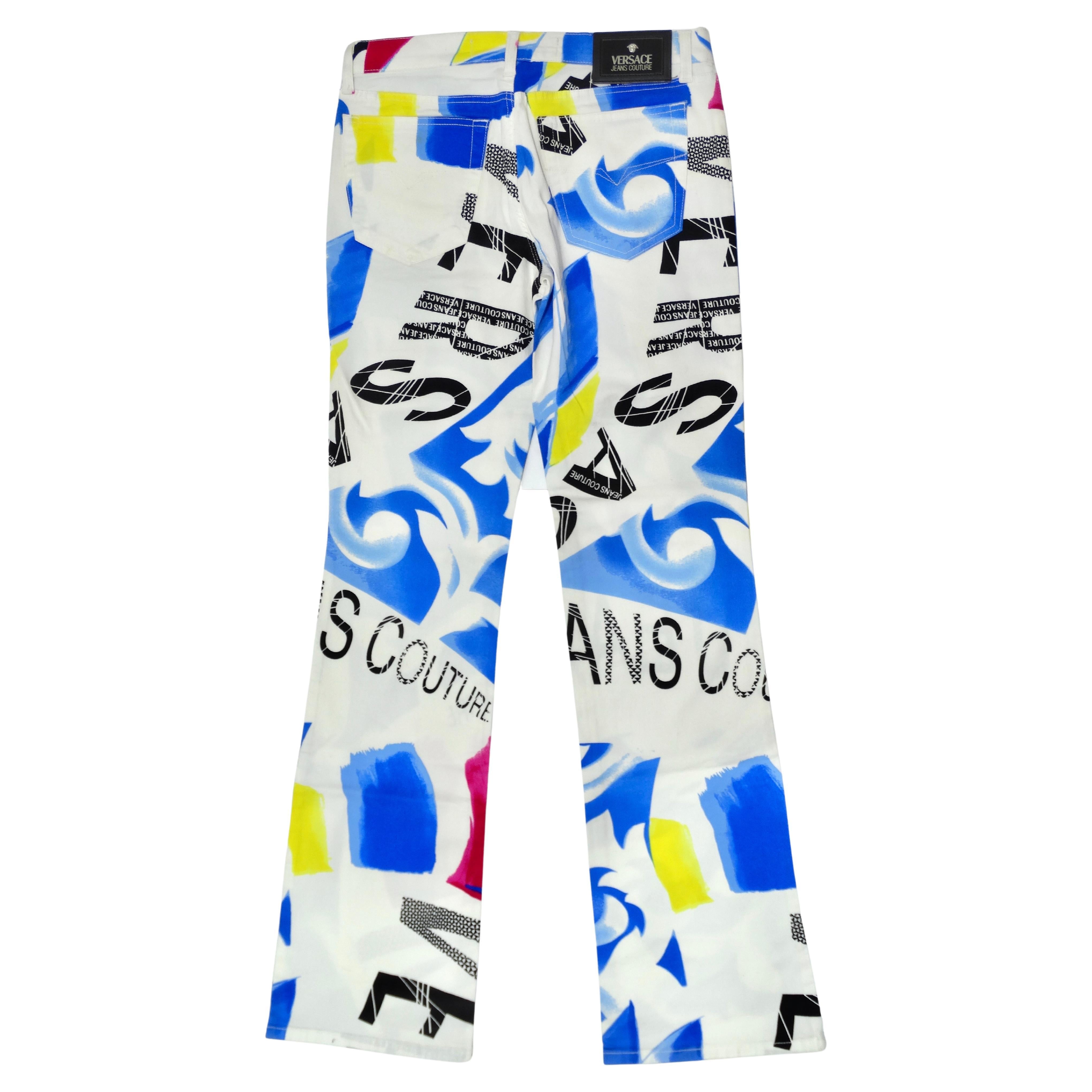 When the jeans ARE the outfit! These are such a fun and vibrant vintage 2000's pair of Versace Jeans Couture. These jeans feature a button closure, flared leg, bold pattern in blue, yellow, and pink, and a mix of large and small lettering of