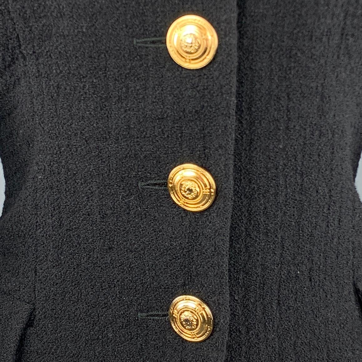Vintage 1990's VERSACE JEANS COUTURE jacket by GIANNI VERSACE comes in wool blend textured fabric with a pointed lapel, cropped hem, and gold tone Medusa buttons. Made in Italy.

Very Good Pre-Owned Condition.
Marked: 28/42

Measurements:

Shoulder: