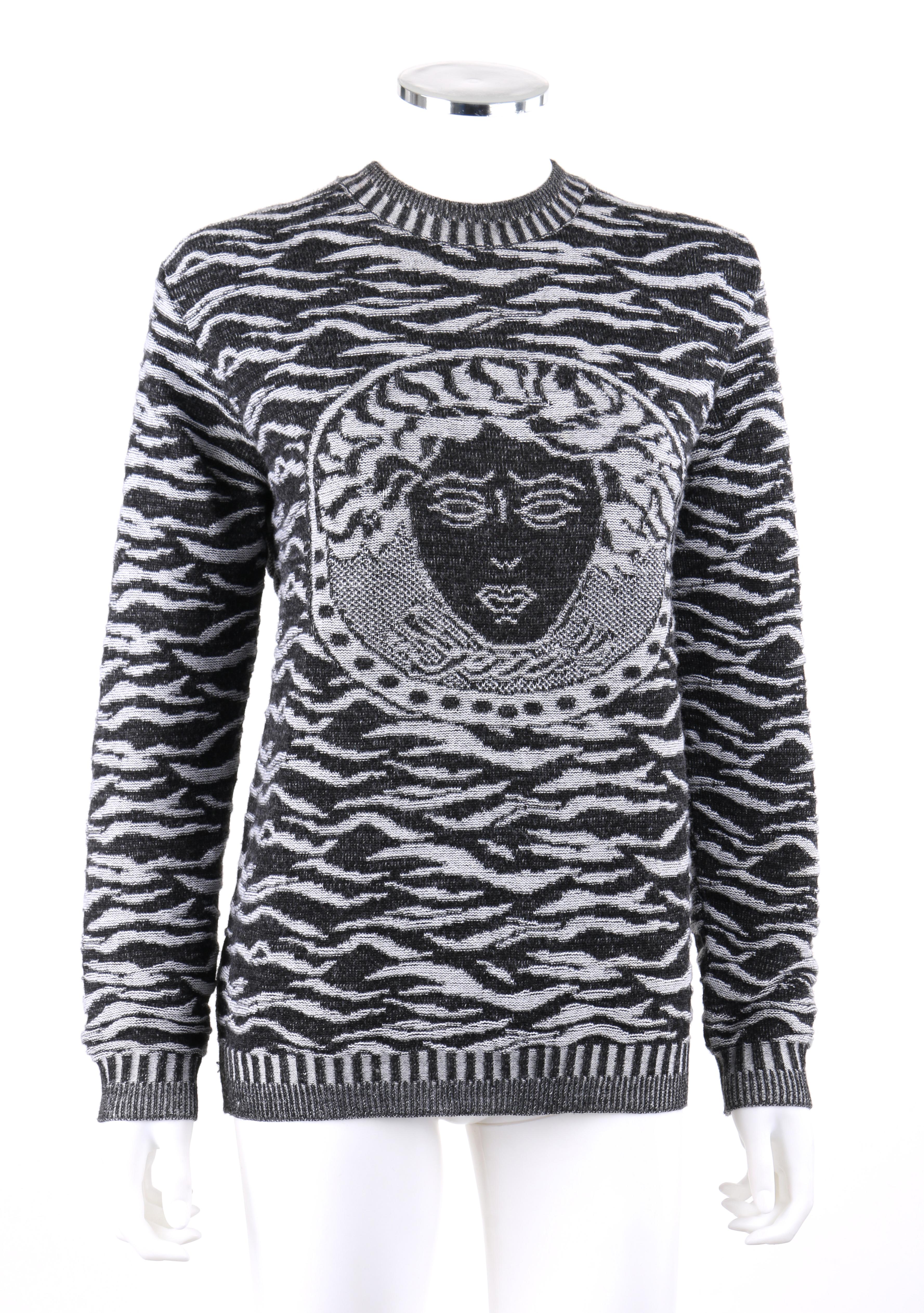 VERSACE Jeans Couture Black White Zebra Print Medusa Face Wool Crew Neck Sweater 
 
Brand / Manufacturer: Versace 
Style: Sweater
Color(s): Shades of black, grey and white. 
Lined: No      
Marked Fabric Content: 50% Acrylic, 50% Wool. 
Additional
