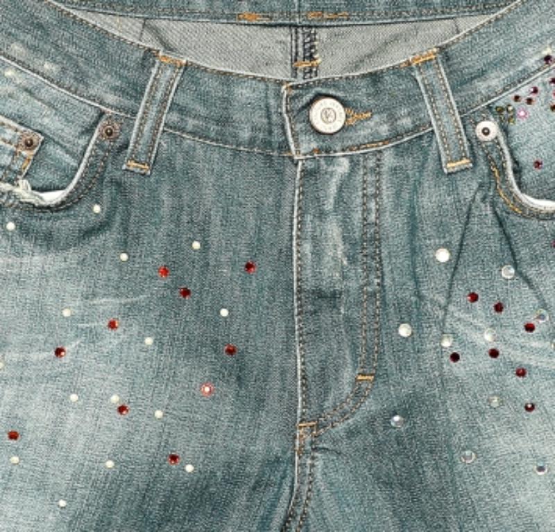 These jeans by Versace Jeans Couture are the perfect pair of trendy, designer bottoms to add to your wardrobe. They are comfortable and up to date with the latest trends in fashion, featuring a flared leg, embellishments, and a blue shade of denim.