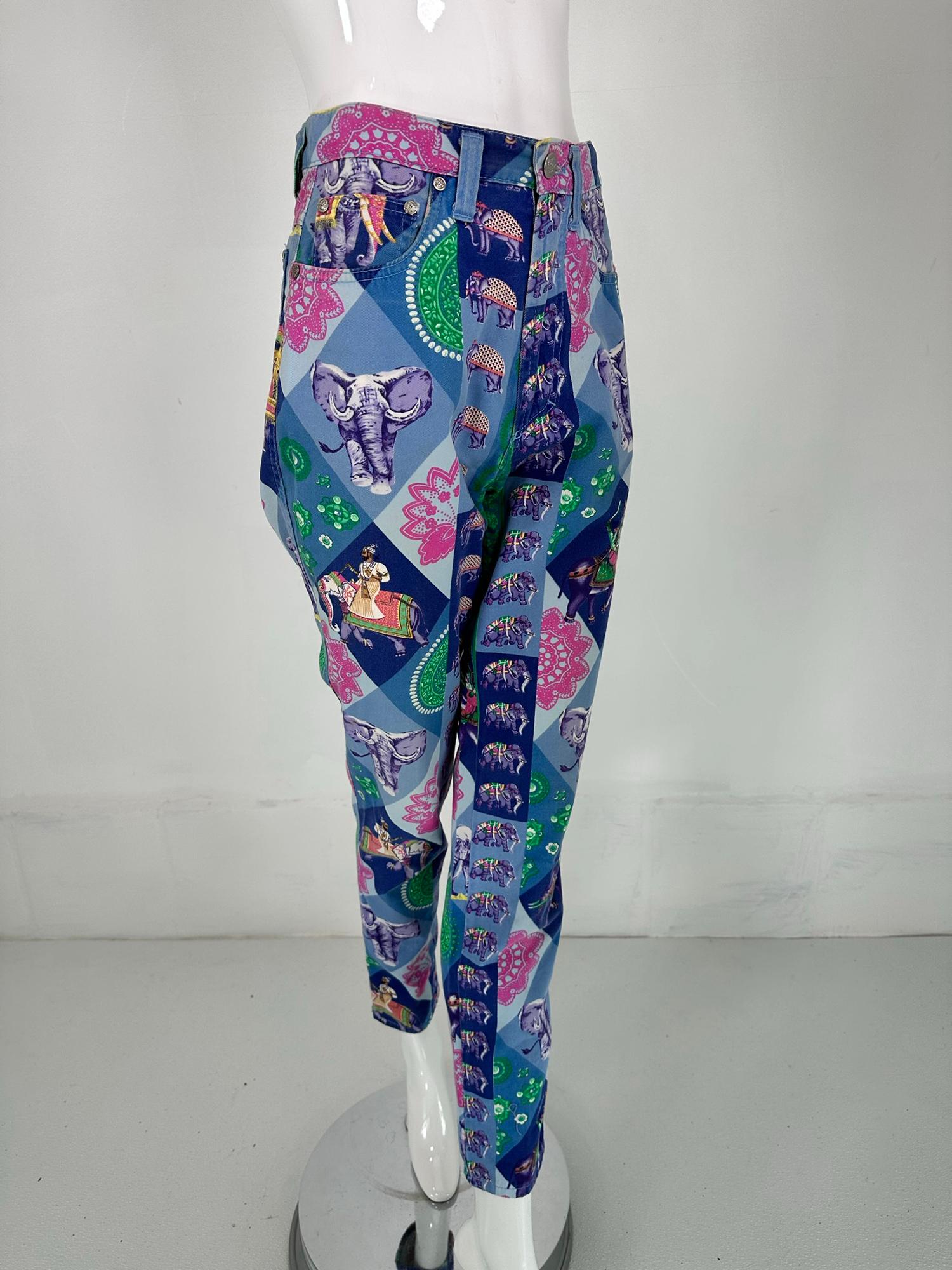 Versace Jeans Couture blue India elephant print, high waist fitted jeans from the 1990s. Brightly printed with elephants, jewels &  goddesses. Done in shades of light blue, dark blue, marine blue with green, yellow & pink. High waist with a fly
