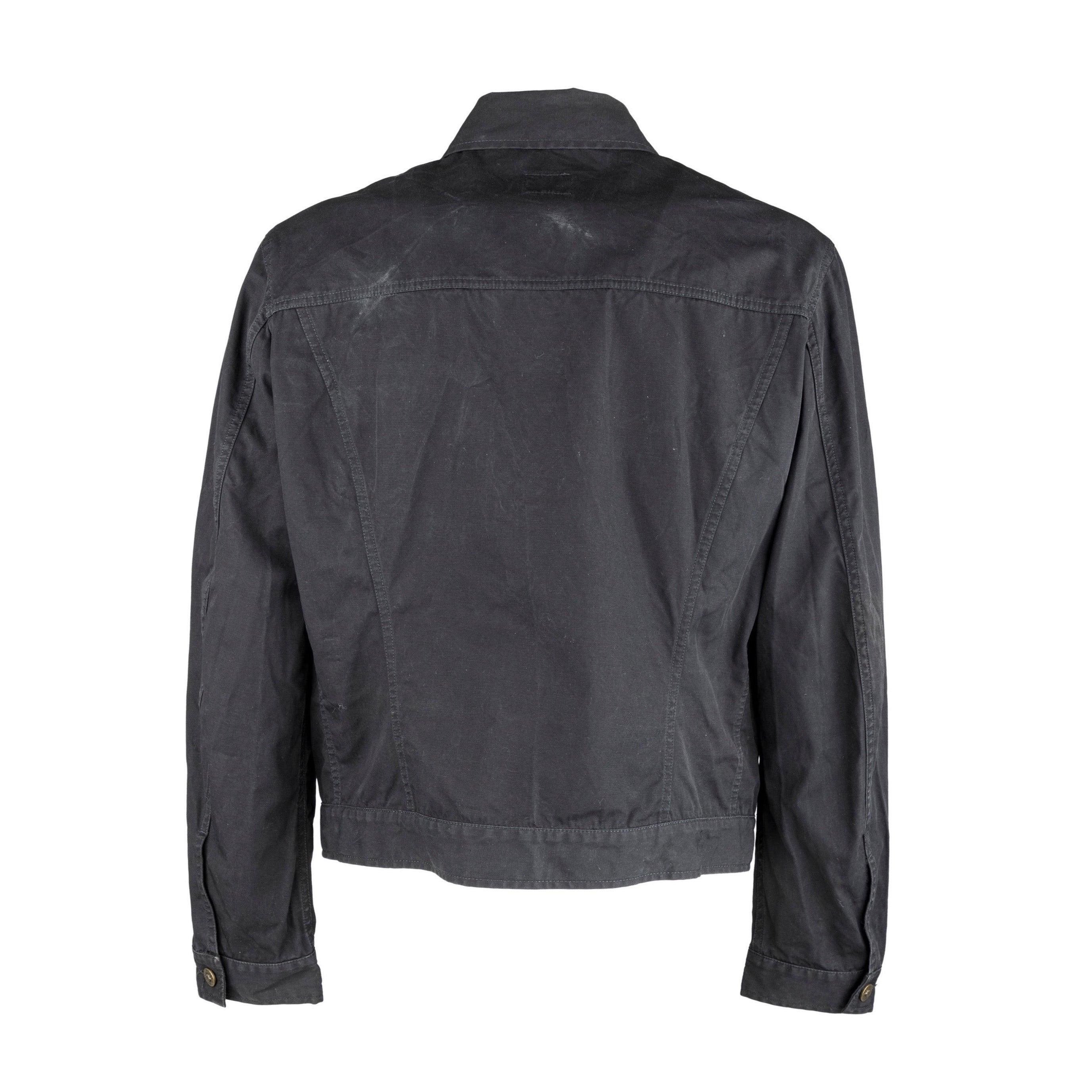 Crafted from cotton with a Polyurethane coating, this Versace Jeans Couture jacket in faded black offers both style and function. Featuring a classic collar and zipper opening, it boasts two buttoned flap pockets and two slanted front pockets. The