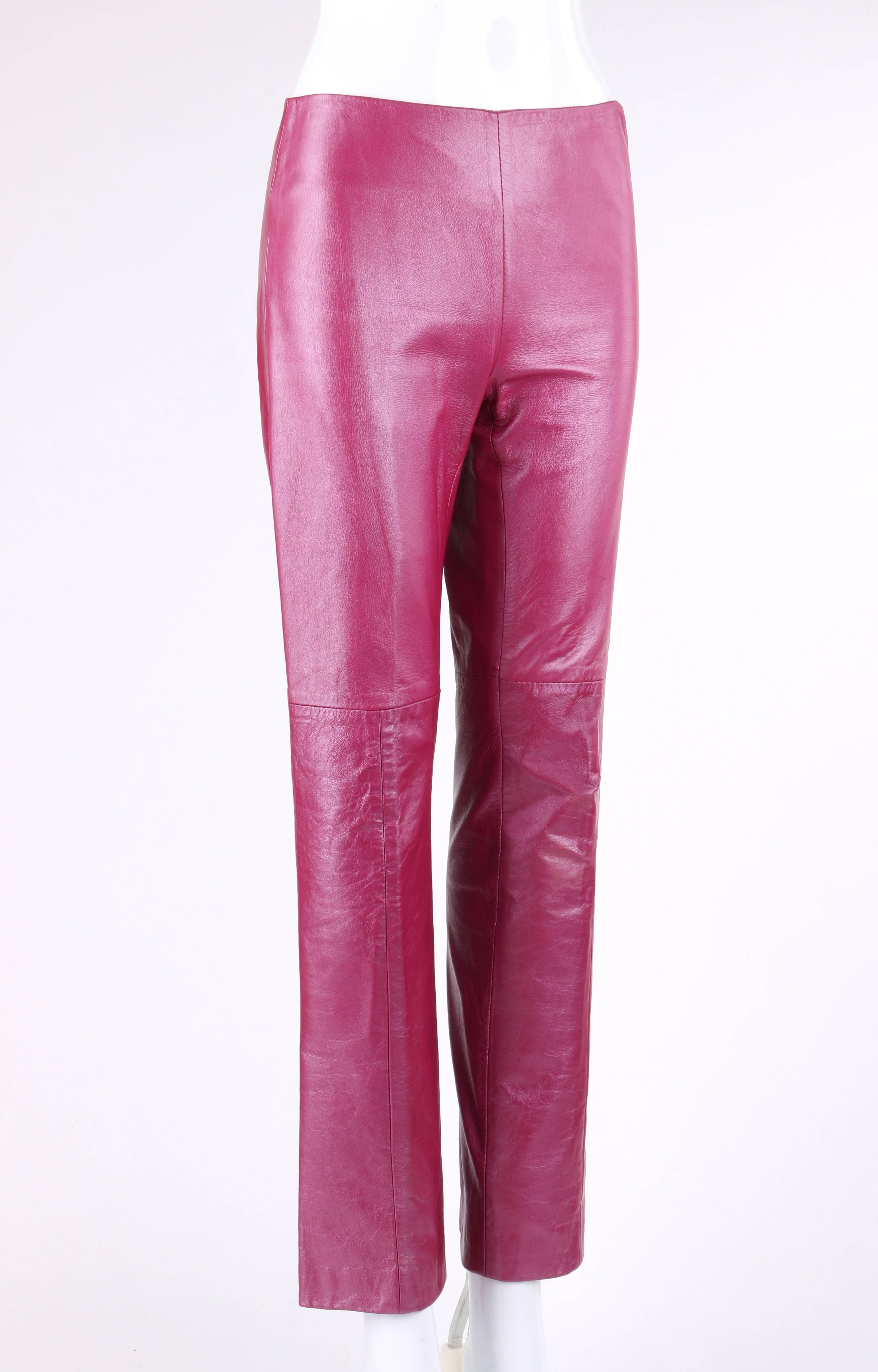 Versace Jeans Couture magenta pink leather boot cut pants. Designed by Donatella Versace. Left side seam invisible zipper closure with silver-toned metal medusa head zipper pull. Boot cut style. Partially lined. Marked Fabric Content: 
