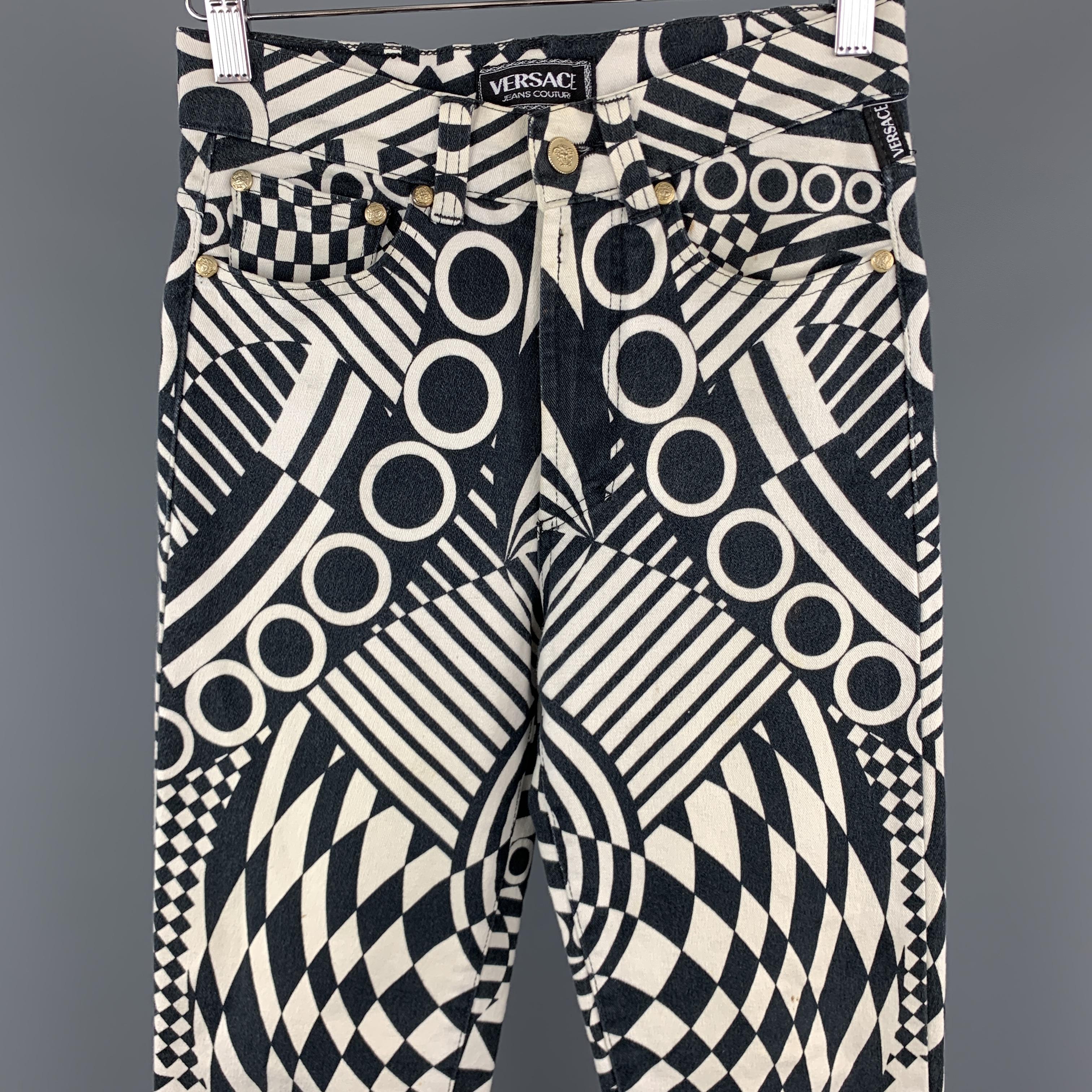 Vintage VERSACE JEANS COUTURE jeans come in black and white geometric print stretch denim with a slim high rise fit and gold tone Medusa hardware. Wear throughout. Made in Italy.

Good Pre-Owned Condition.
Marked: 32 46

Measurements:

Waist: 27 