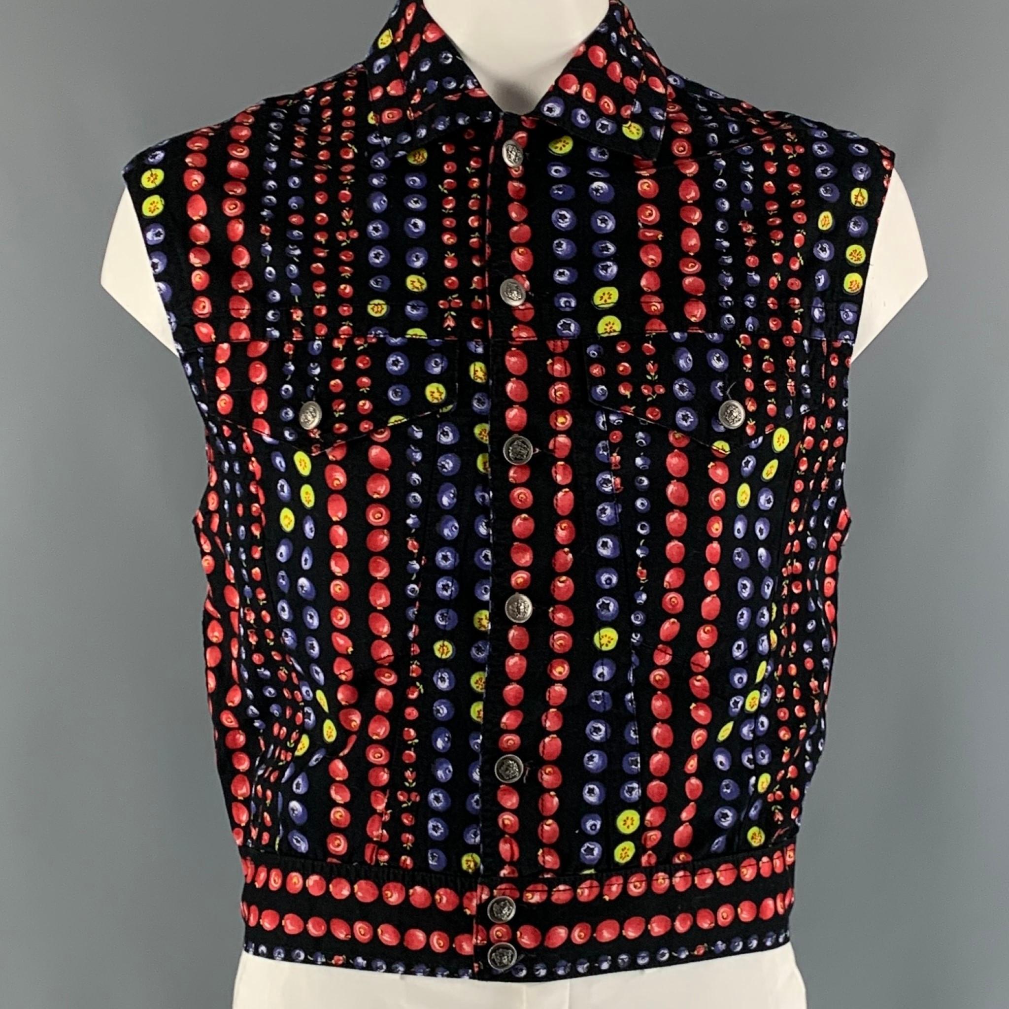 VERSACE JEANS COUTURE vest comes in a black and red fruits printed cotton twill material featuring a trucker style, flap front pockets, and a silver medusa buttons closure. Made In Italy.

Very Good Pre-Owned Condition.
Marked: