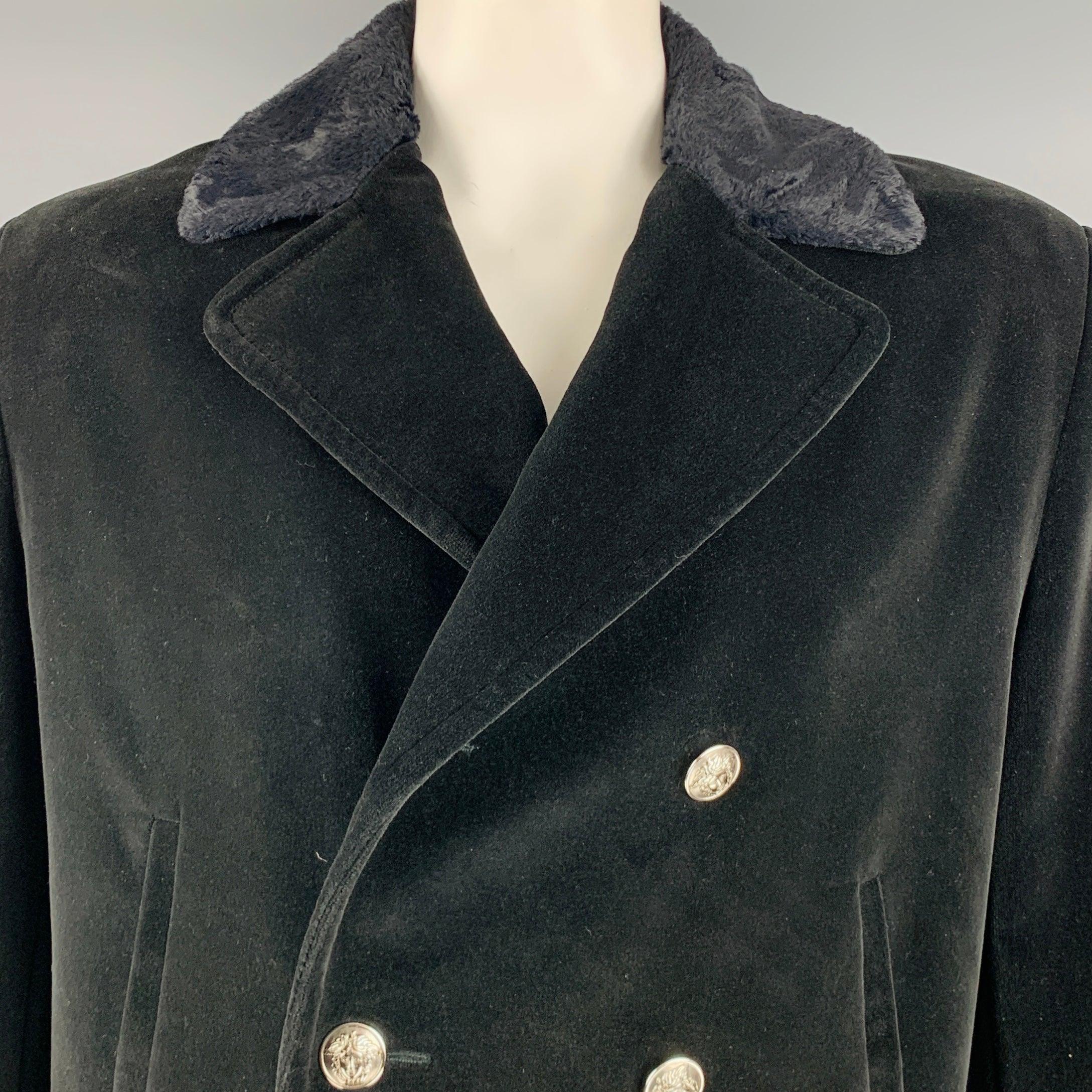 VERSACE JEANS COUTURE coat
in a black cotton velvet fabric featuring a double breasted style, faux fur trim, and button closure signature silver tone Medusa buttons.
Comes with removable back belt. Made in Italy.Very Good Pre-Owned Condition.