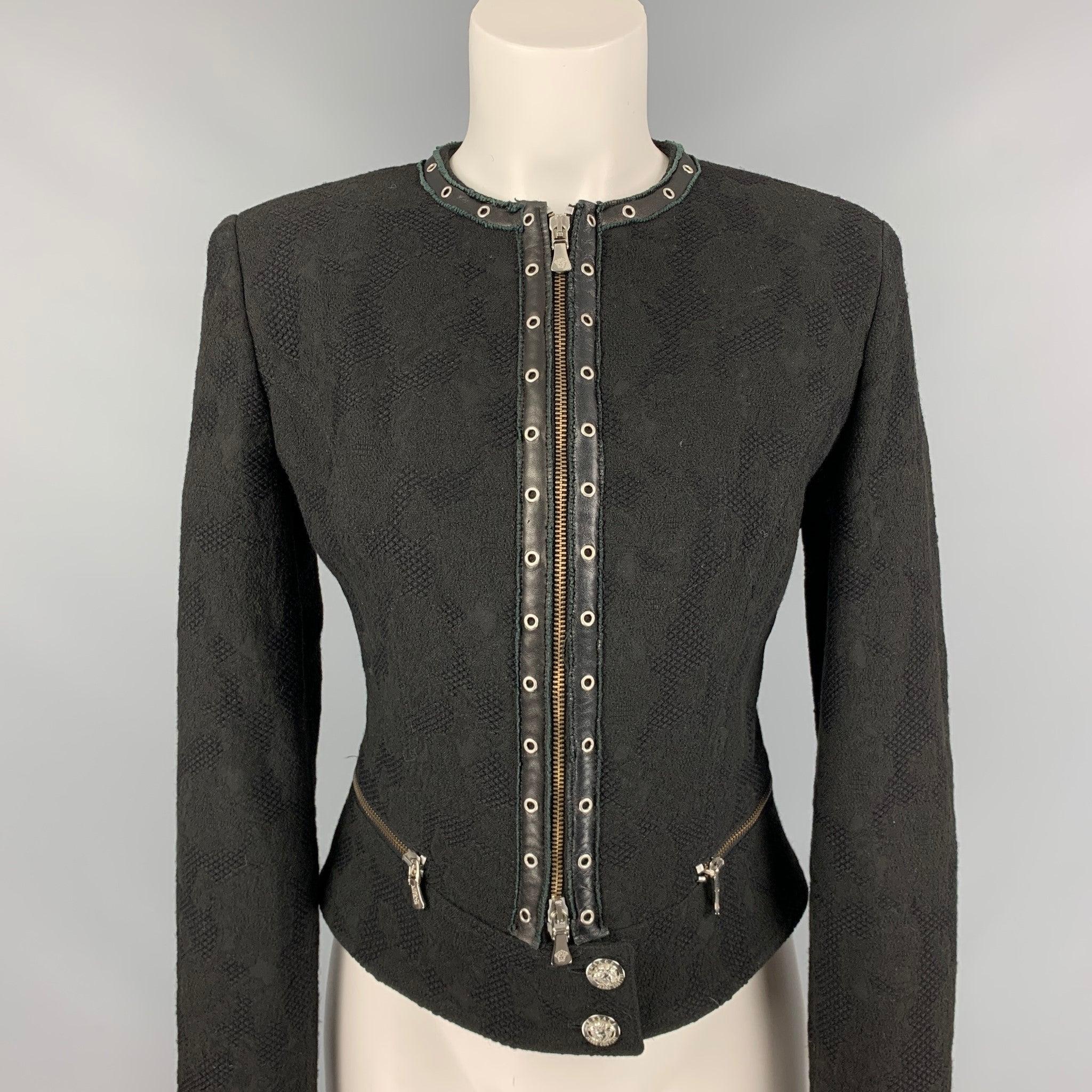 VERSACE JEANS COUTURE jacket comes in a black jacquard material featuring a grommet trim, silver tone hardware, logo buttons, leather trim, collarless, and a zip up closure.
Very Good
Pre-Owned Condition. 

Marked:   M 

Measurements: 
 
Shoulder: