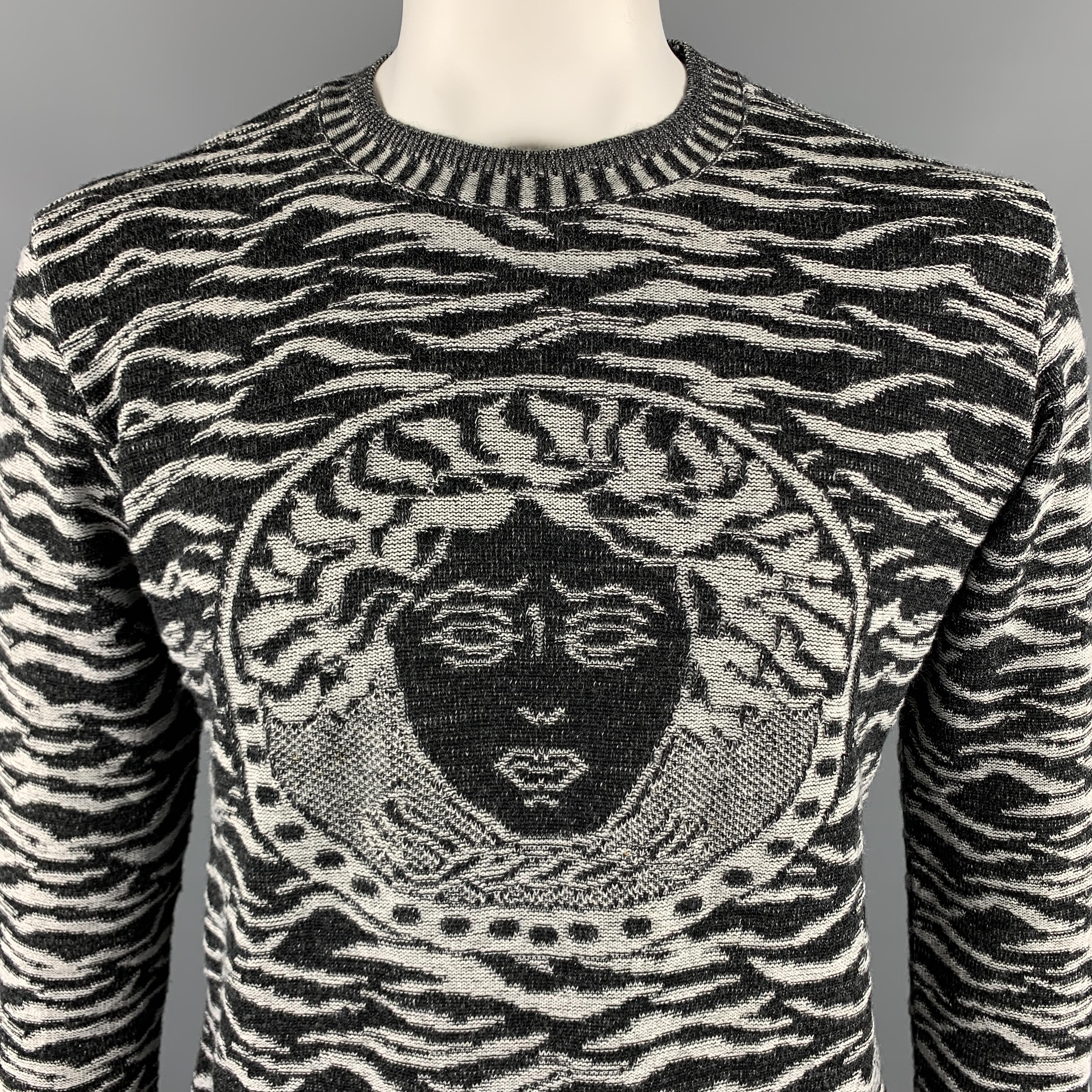 VERSACE JEANS COUTURE pullover sweater comes in  black and grey textured wool material, featuring a woven medusa head at chest, a crewneck, and ribbed cuffs and hem. Made in Italy.

Excellent Pre-Owned Condition.
Marked: XXL