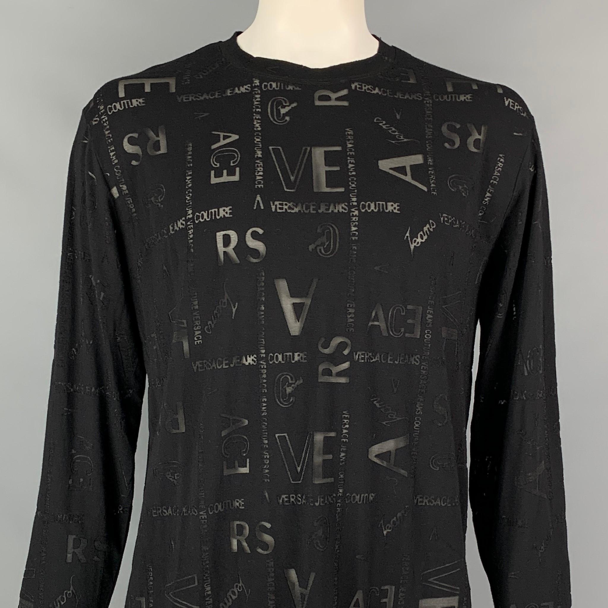 VERSACE JEANS COUTURE pullover comes in a black viscose blend with a all over see through logo design featuring a crew-neck. Made in Italy.

Very Good Pre-Owned Condition.
Marked: XXXL

Measurements:

Shoulder: 21 in.
Chest: 46 in.
Sleeve: 26.5