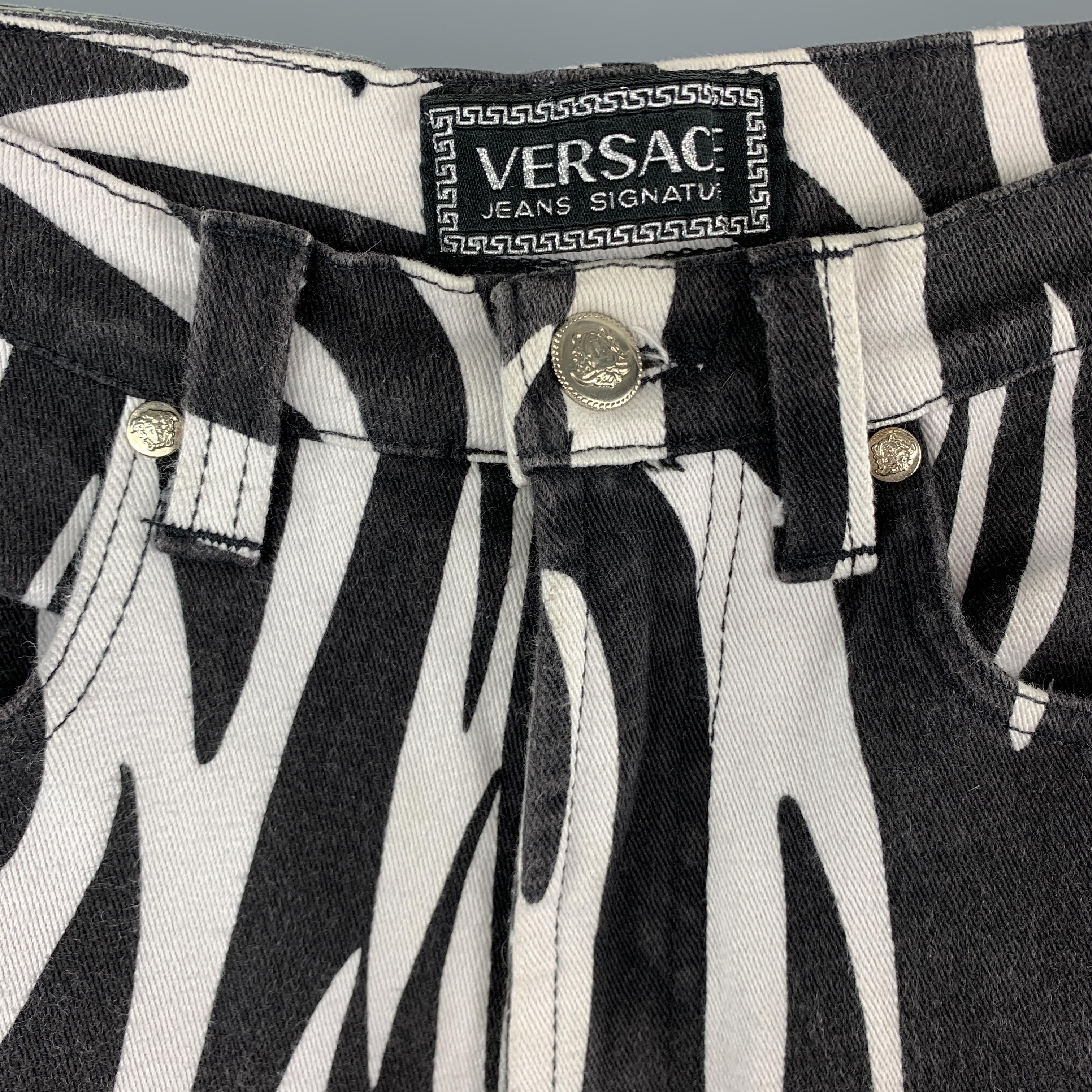 Vintage VERSACE JEANS SIGNATURE jeans come in zebra print stretch denim with a slim high rise fit and silver tone Medusa hardware. Wear throughout. Made in Italy.

Good Pre-Owned Condition.
Marked: 28 42

Measurements:

Waist: 25 in.
Rise: 11