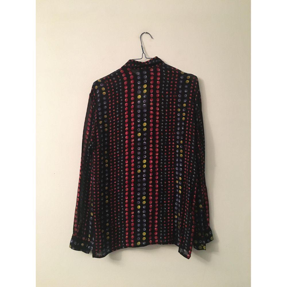Versace Jeans Silk Blouse in Multicolour

Versace Jeans Couture shirt. There is no composition label but we think it is silk. Nice print of small red fruits. Semi transparent material. Size M. Measures 42cm shoulders, 46cm bust, 68cm long and 65cm