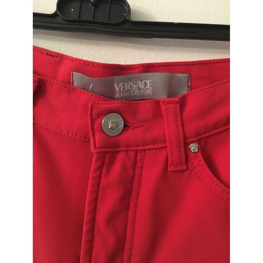 Pantalon rouge en jean et spandex Versace Pour femmes en vente