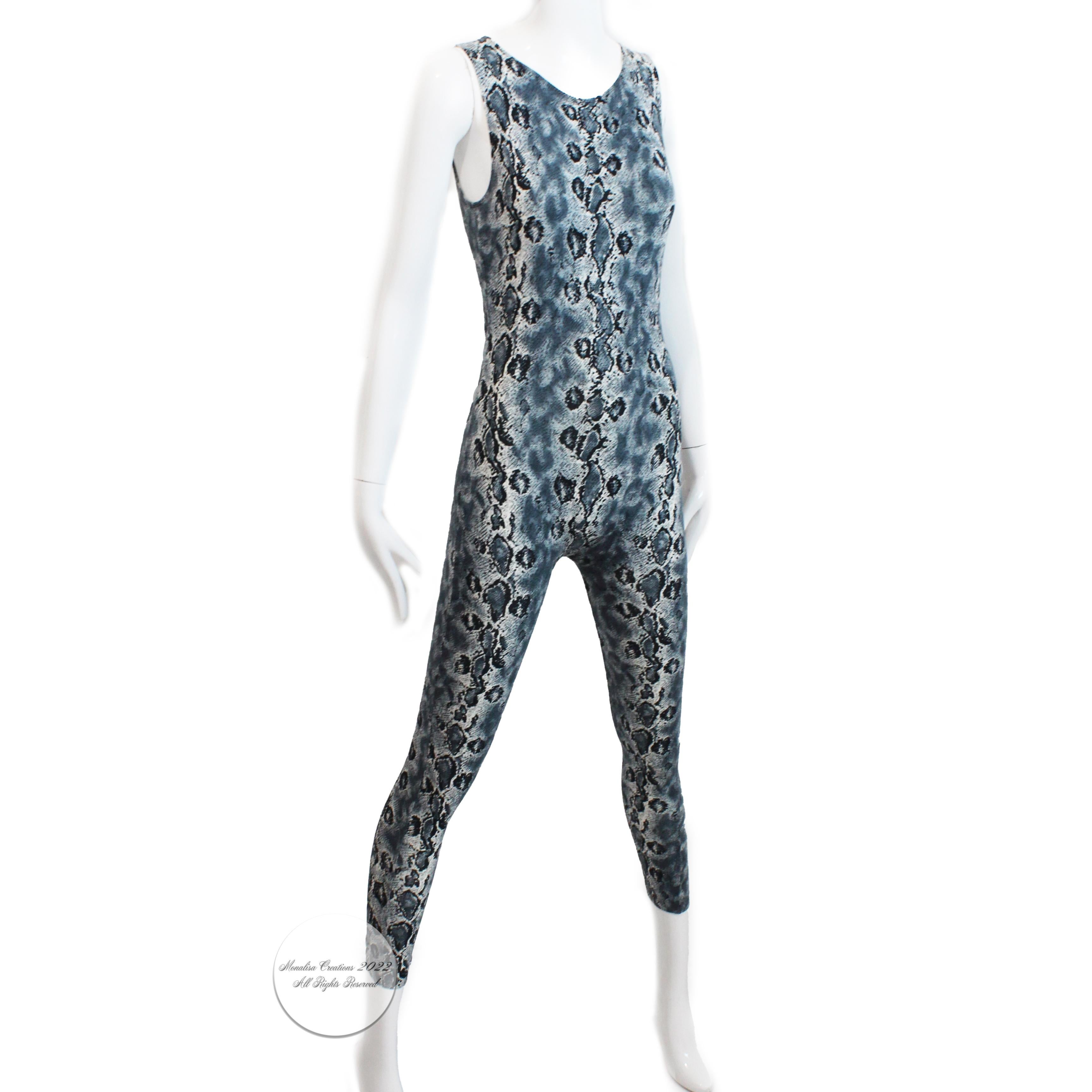 Fabulous Versace Versus snakeskin print jumpsuit, most likely made in the 90s.  Made from a stretchy Viscose/Spandex blend fabric, it fastens with a rear zipper and hugs ones curves!  So versatile and chic, it can be easily styled in a variety of