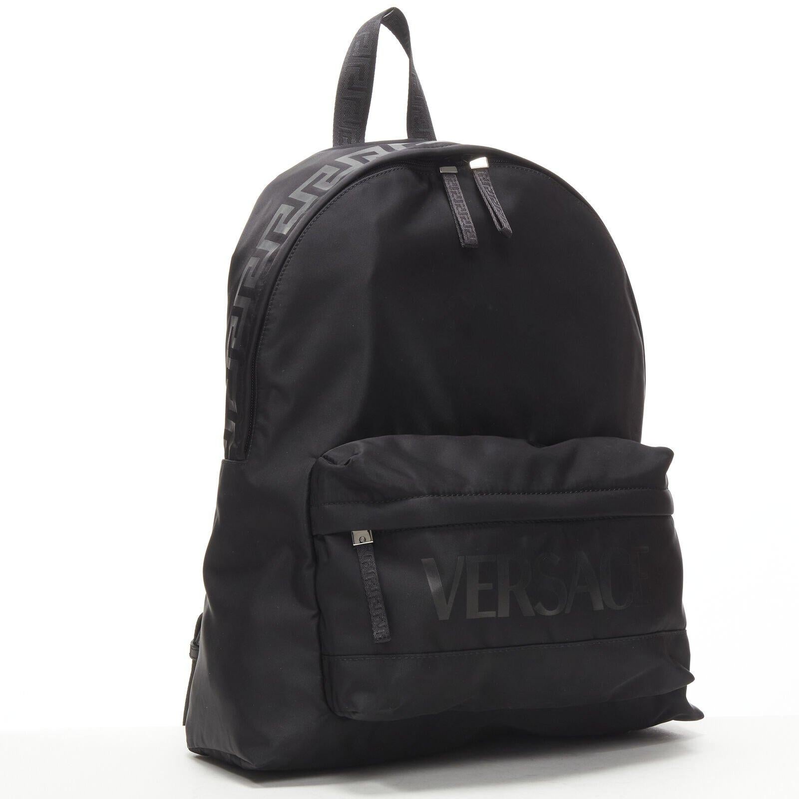VERSACE La Greca 90's logo black nylon backpack bag
Reference: TGAS/C00521
Brand: Versace
Designer: Donatella Versace
Model: 1002886 1A02180 2B77E
Collection: La Greca
Material: Nylon
Color: Black
Pattern: Solid
Closure: Zip
Lining:  Fabric
Extra
