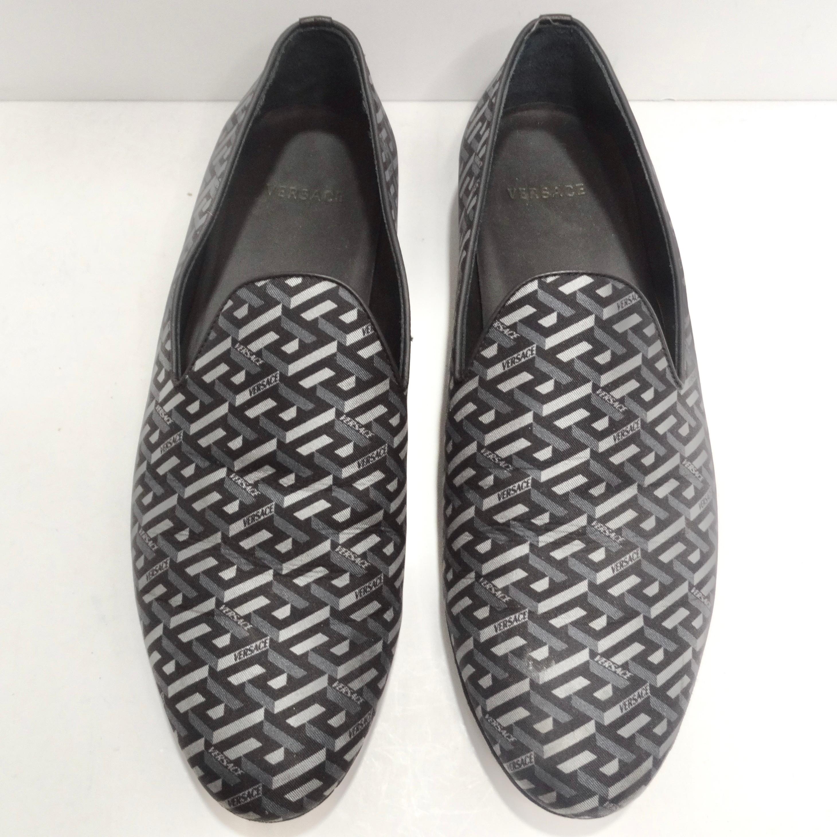 Introducing the Versace La Greca Jacquard Loafers—a pair of sleek slippers that seamlessly blend classic style with a bold Versace touch. These loafers aren't just shoes; they are a statement of timeless sophistication and the unmistakable flair of