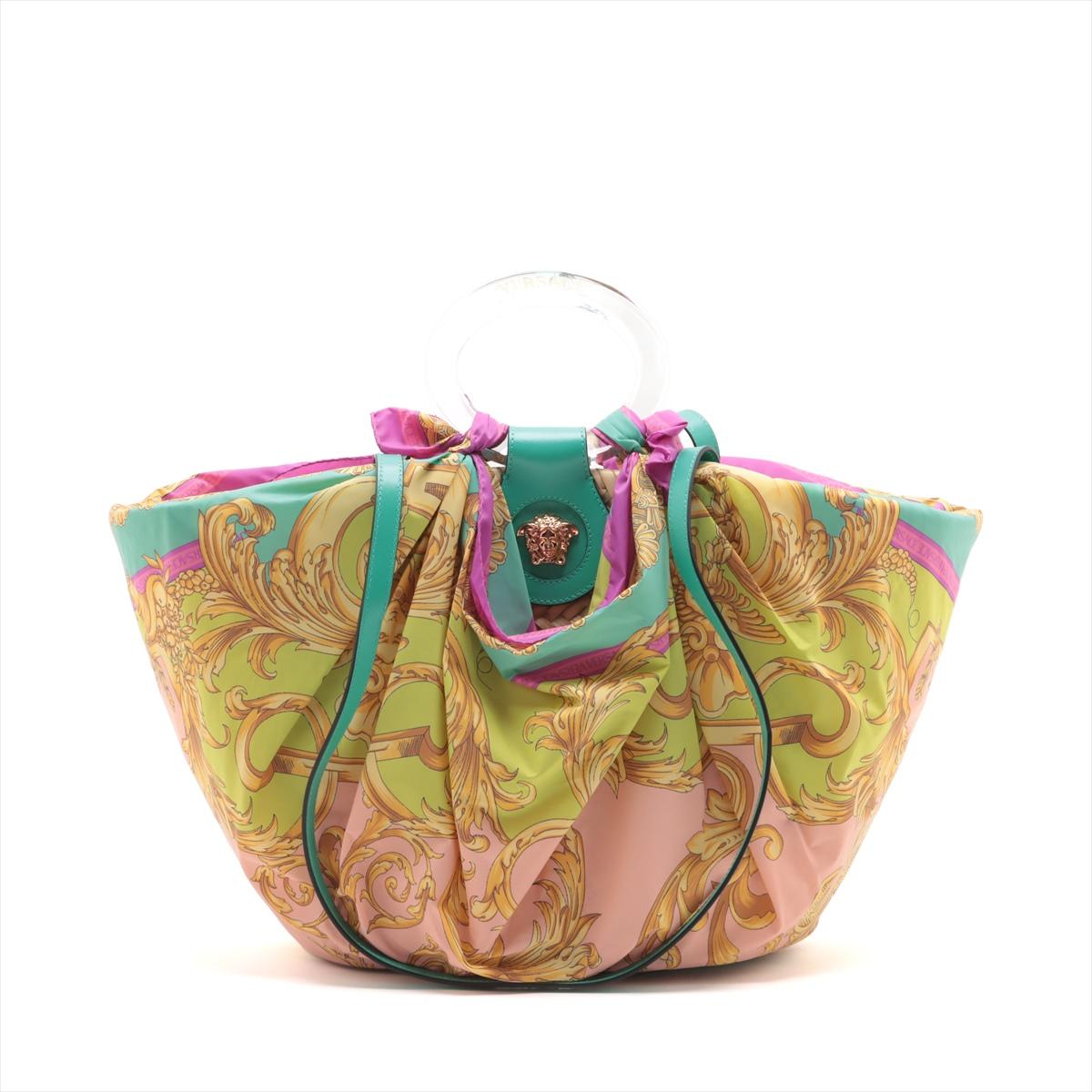 The Versace La Medusa Basket Raffia Two-Way Handbag in Multicolor is a striking blend of luxury and playful design. Crafted from durable raffia, the handbag features an acrylic top handle and two long leather straps, offering versatile carrying