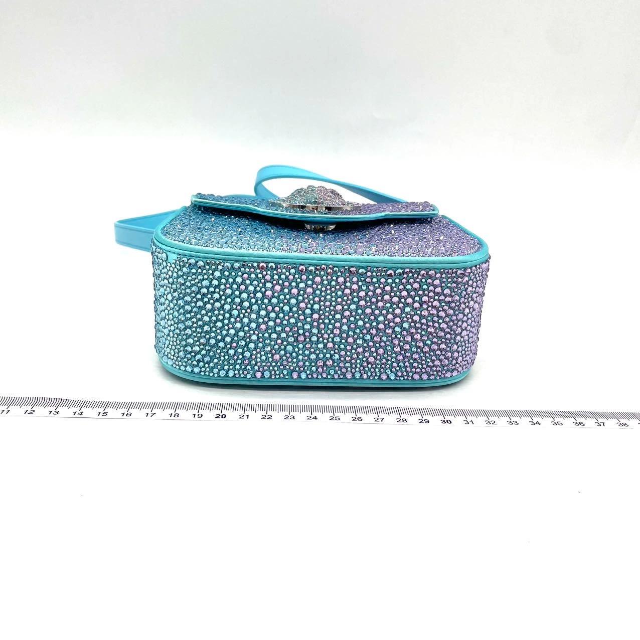 Versace La Medusa Mini Crystal Embellished Top Handle Bag in Blue Pink
These are professional photos of the actual bag offered by Luxbags.
CONDITION: MINT LIKE NEW
Light scratches to the hardware.
DETAILS

Versace
Size: Mini

Bottom Width: 16cm 