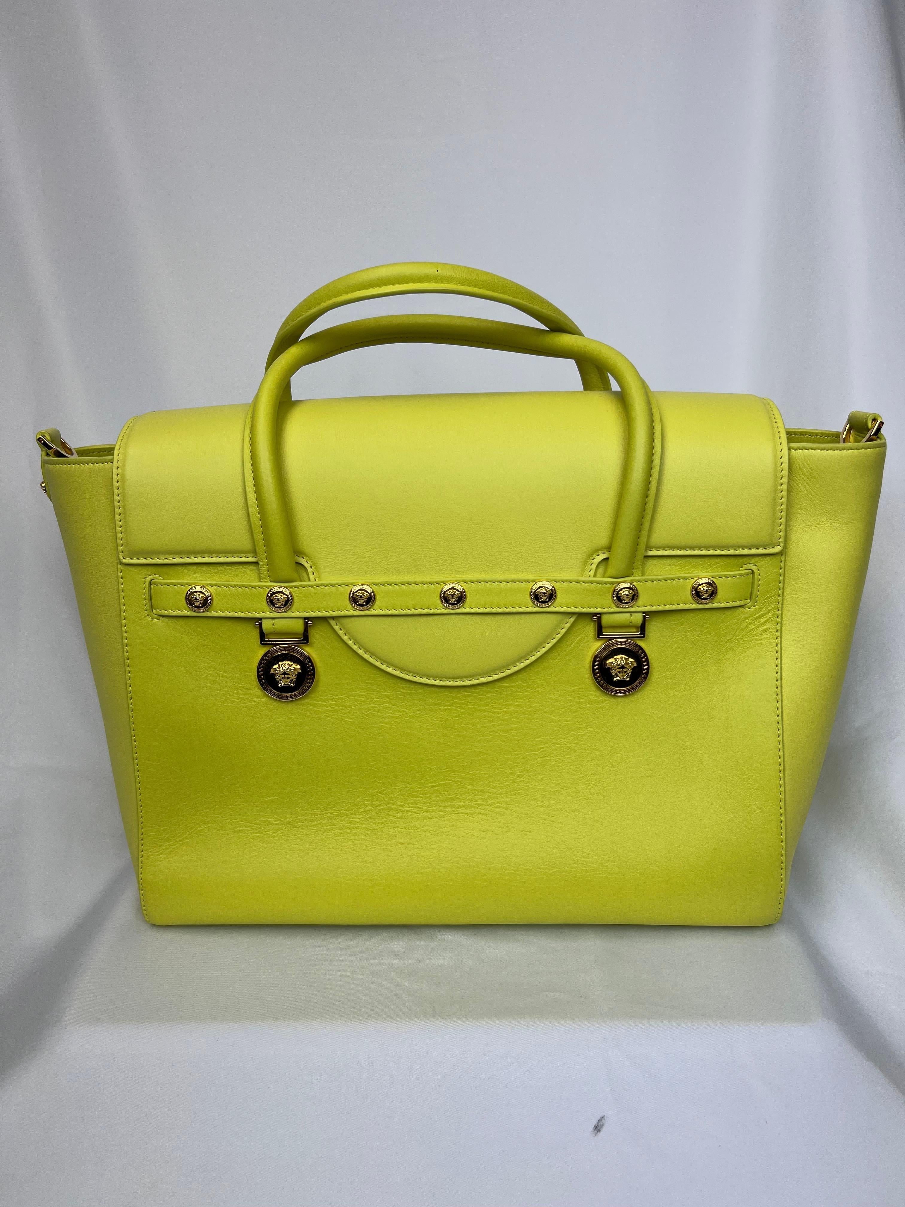 Exuding bold sophistication, the Versace Leather Large Medusa Medallion Tote is a statement piece that showcases the brand's iconic design elements. Crafted from supple leather, this tote features a sleek, structured silhouette and is adorned with