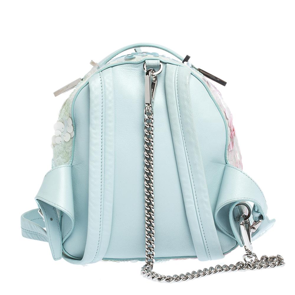 Add a hint of glamour to your every day dressing with this stylish & striking backpack from Versace. You will surely attract compliments and admirers every time you don this luxurious creation. Crafted from light blue suede & leather, this backpack