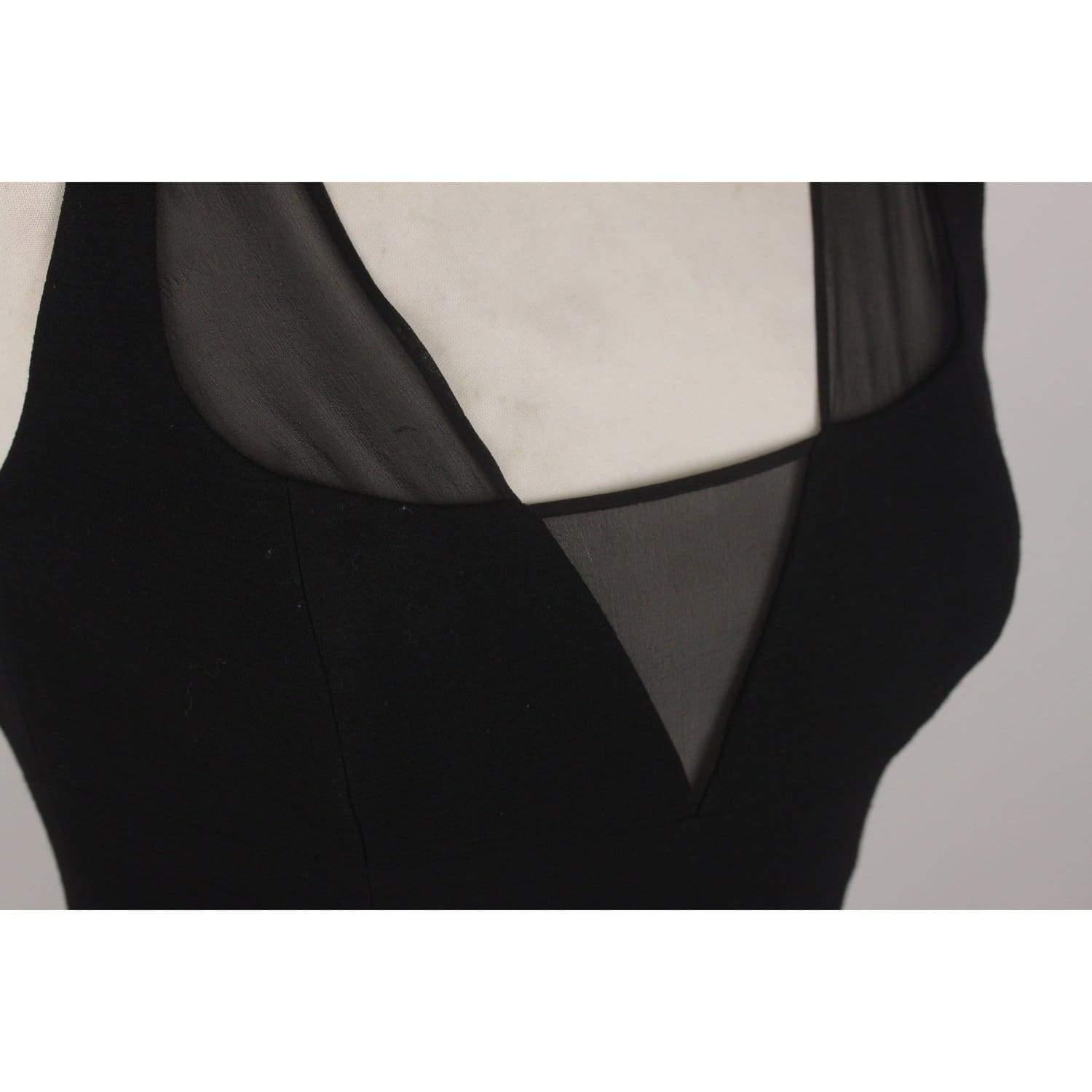 MATERIAL: Wool COLOR: Black MODEL: Little Black Dress GENDER: Women SIZE: Extra-Small COUNTRY OF MANUFACTURE: Italy Condition CONDITION DETAILS: A :EXCELLENT CONDITION - Used once or twice. Looks mint. Imperceptible signs of wear Measurements