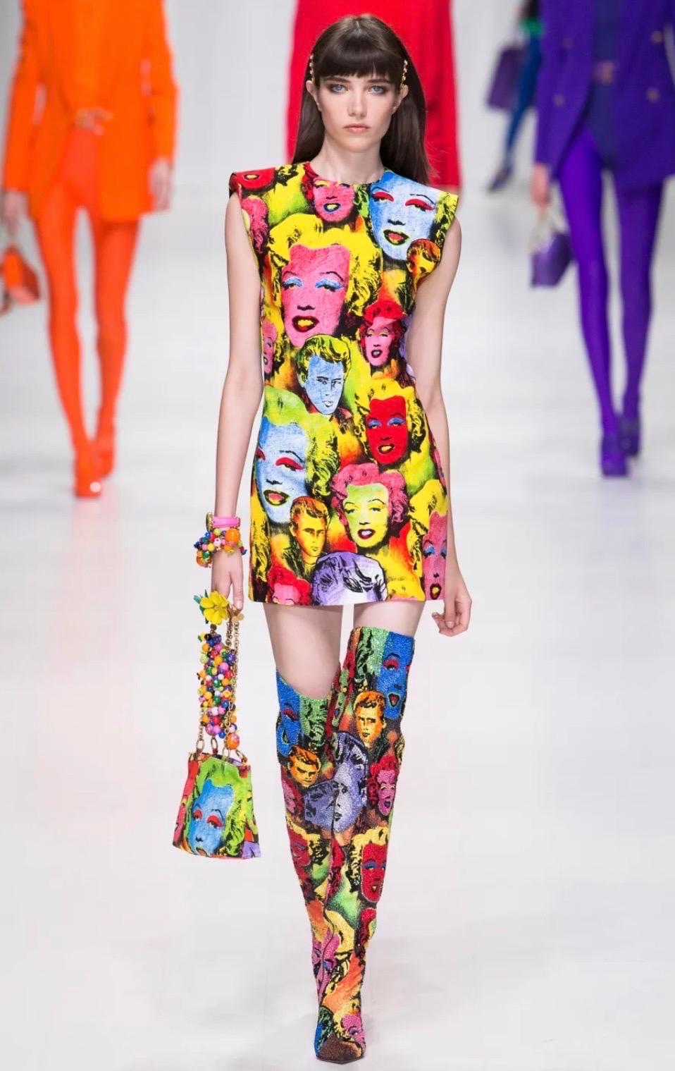 Versace Spring 2018 Marilyn Monroe printed mini dress. As seen on the runway. This padded shoulder pop art mini dress is an homage to the iconic Gianni Versace Marilyn Monroe dress from the Spring Summer 1991 collection.
Zip back closure
Made in