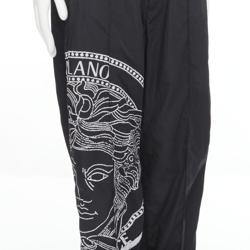 VERSACE Medusa Big Logo print black nylon Y2K track pants IT54 XXL
Reference: TGAS/C00543
Brand: Versace
Designer: Donatella Versace
Model: A89410 1F00957 1B000
Material: Nylon
Color: Black
Pattern: Solid
Closure: Elasticated
Extra Details: Black