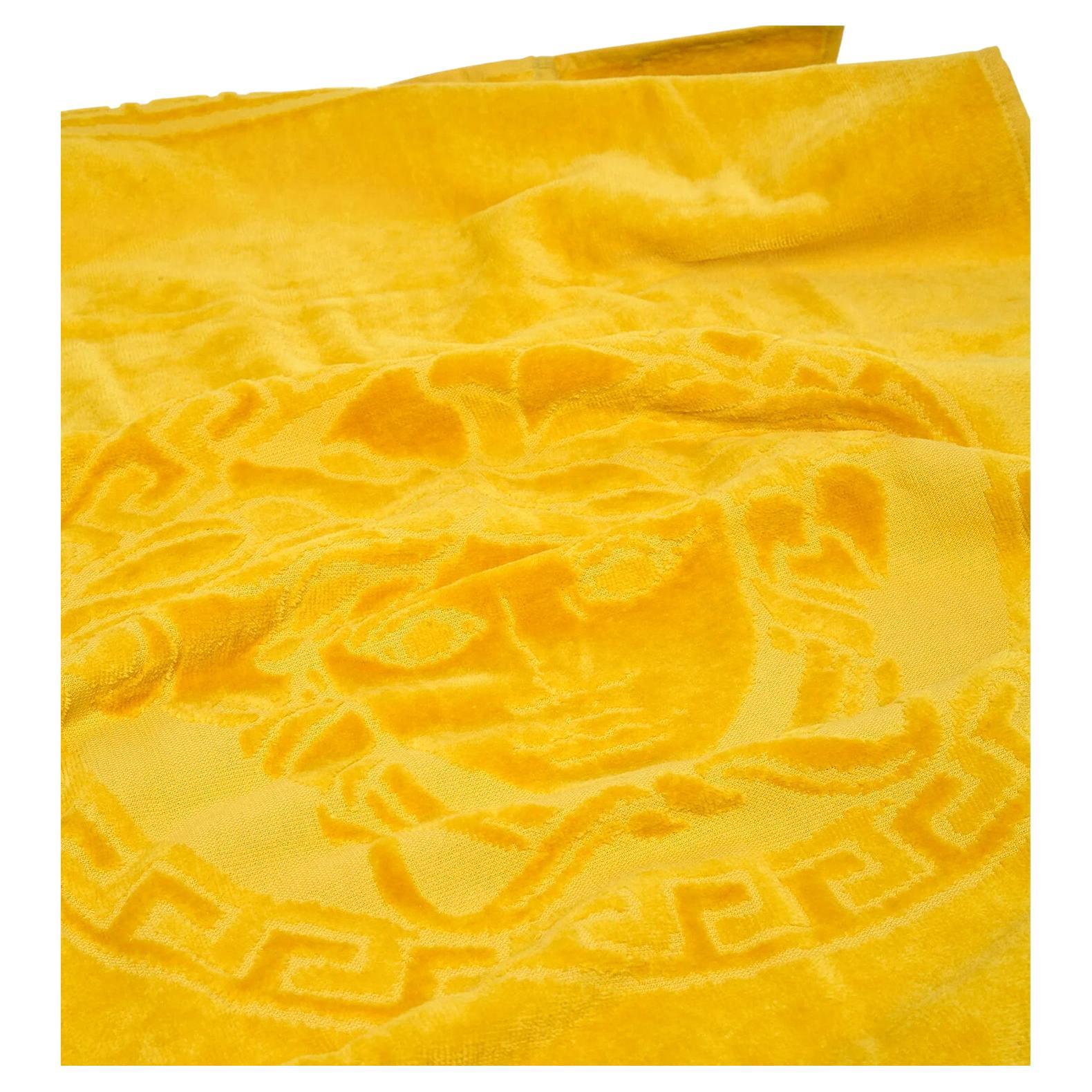 Versace Medusa gold hand towel, deep yellow, Italy. Perfect for pampering yourself or your guest, Versace towels are a must have for any contemporary and luxurious home. 100% Cotton See dimensions below:
One hand towel: 16